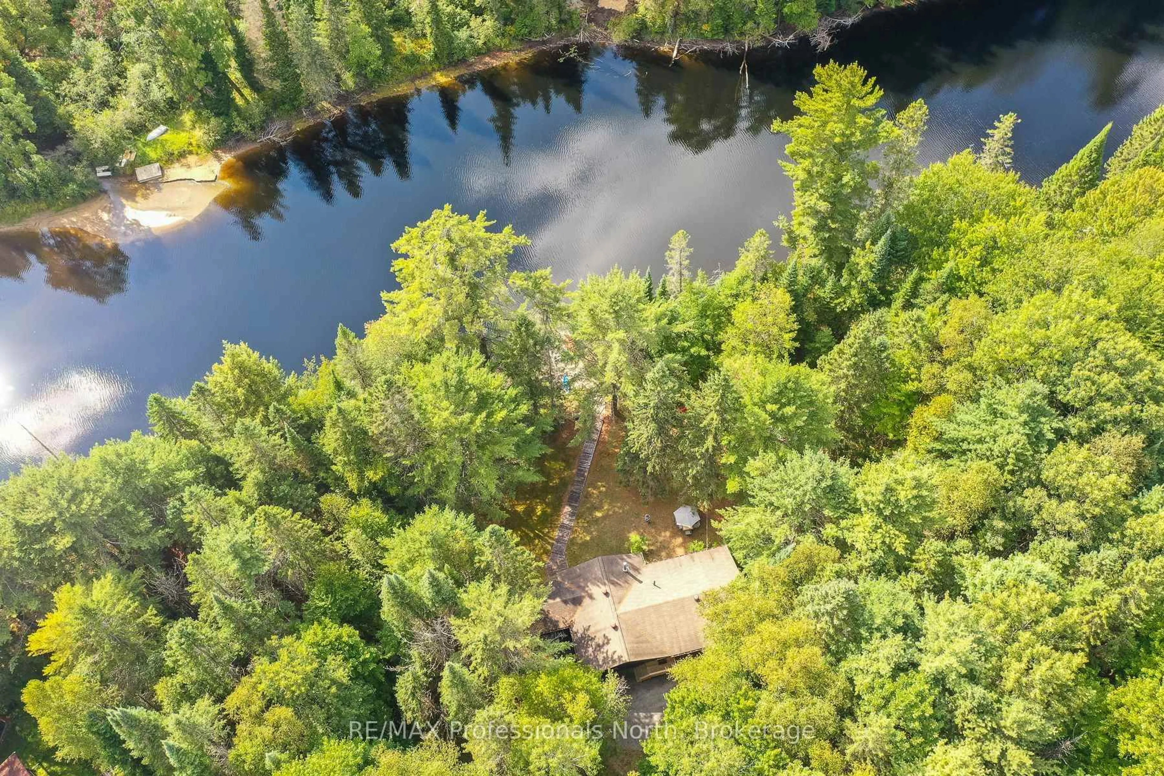 A pic from outside/outdoor area/front of a property/back of a property/a pic from drone, water/lake/river/ocean view for 128 Rusnick Dr, Huntsville Ontario P0B 1L0