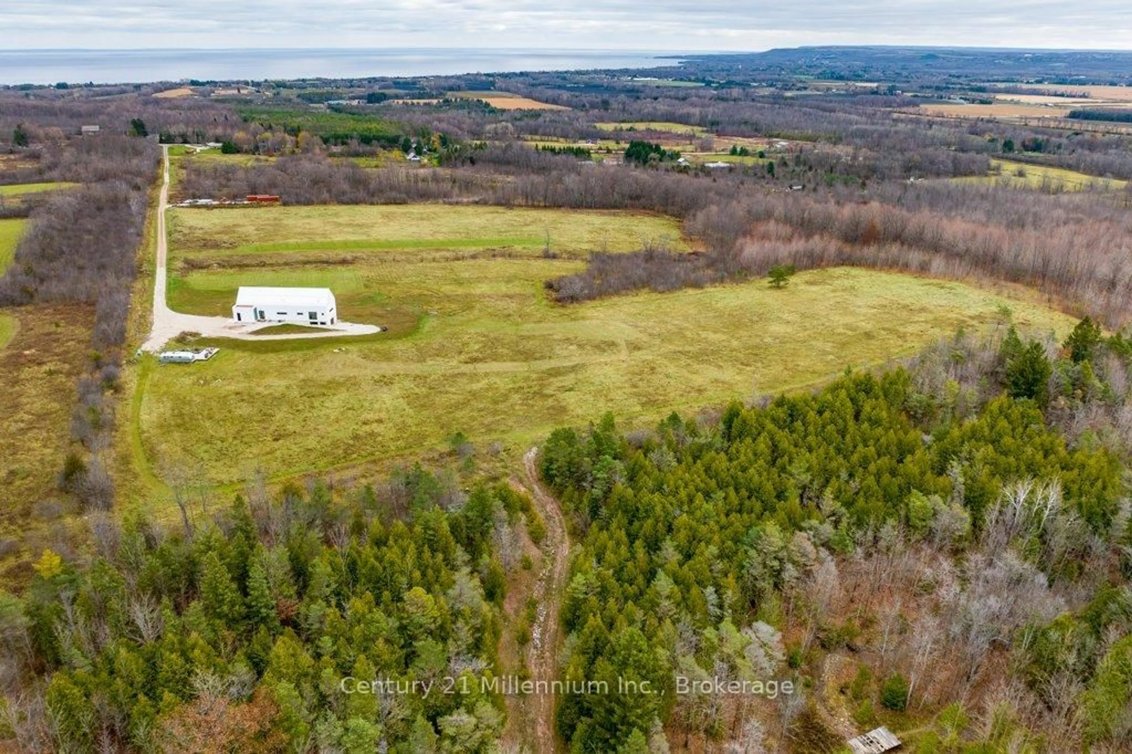 A pic from outside/outdoor area/front of a property/back of a property/a pic from drone, forest/trees view for 138406 Grey Road 112, Meaford Ontario N4L 1W5
