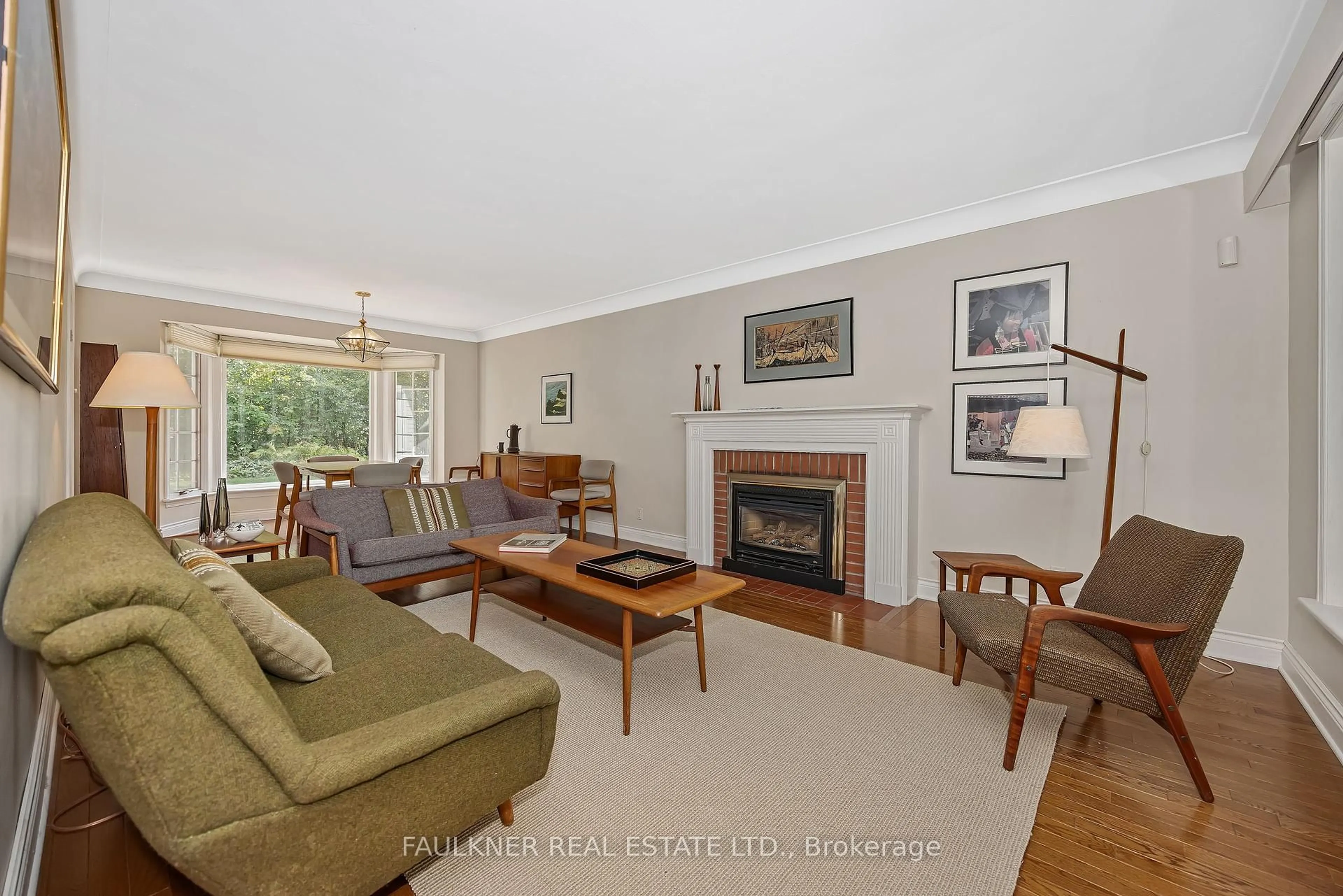 Living room with furniture, wood/laminate floor for 412 Thessaly Circ, Ottawa Ontario K1H 5W5