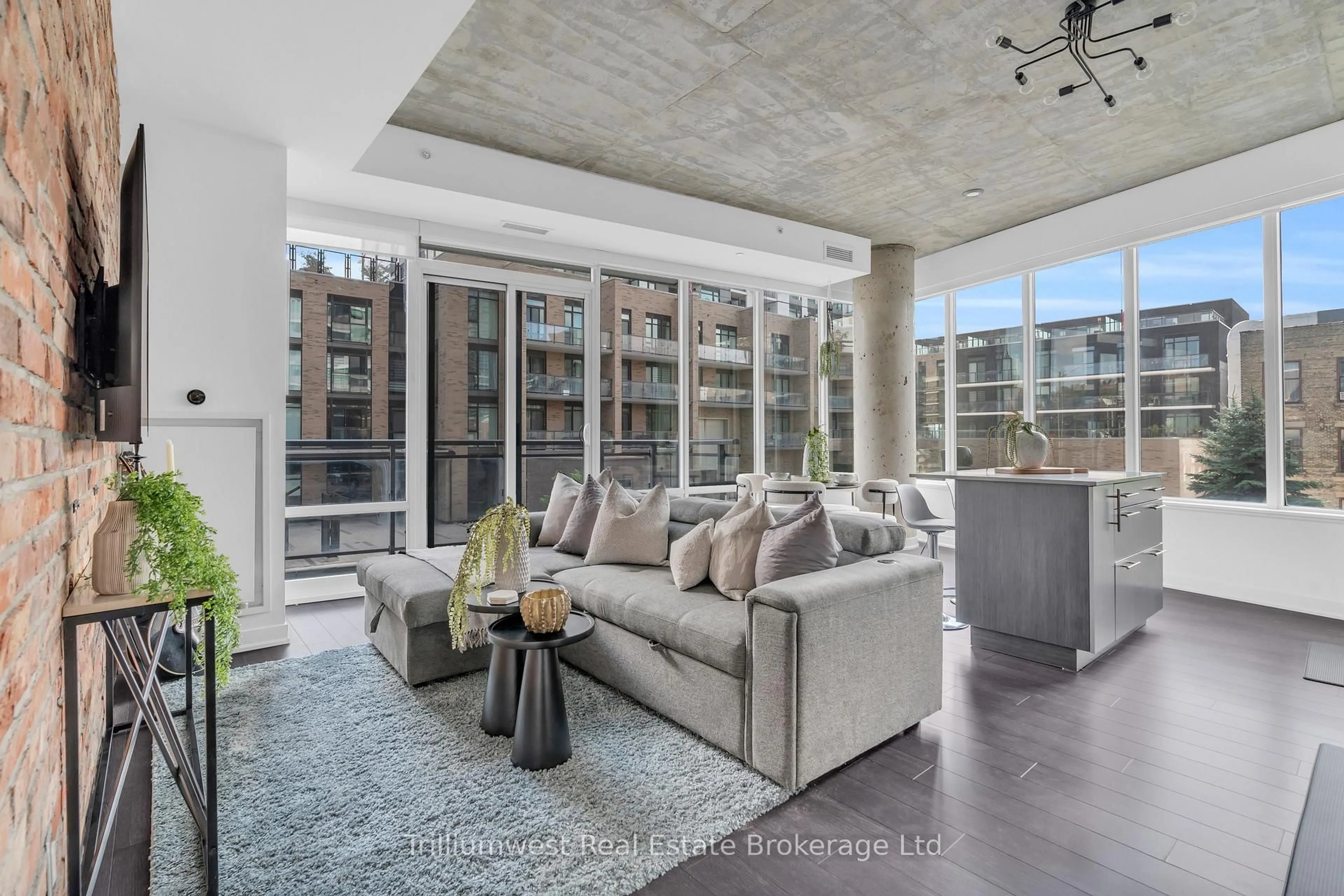 Living room with furniture, cement floor for 85 Duke St #209, Kitchener Ontario N2H 0B7