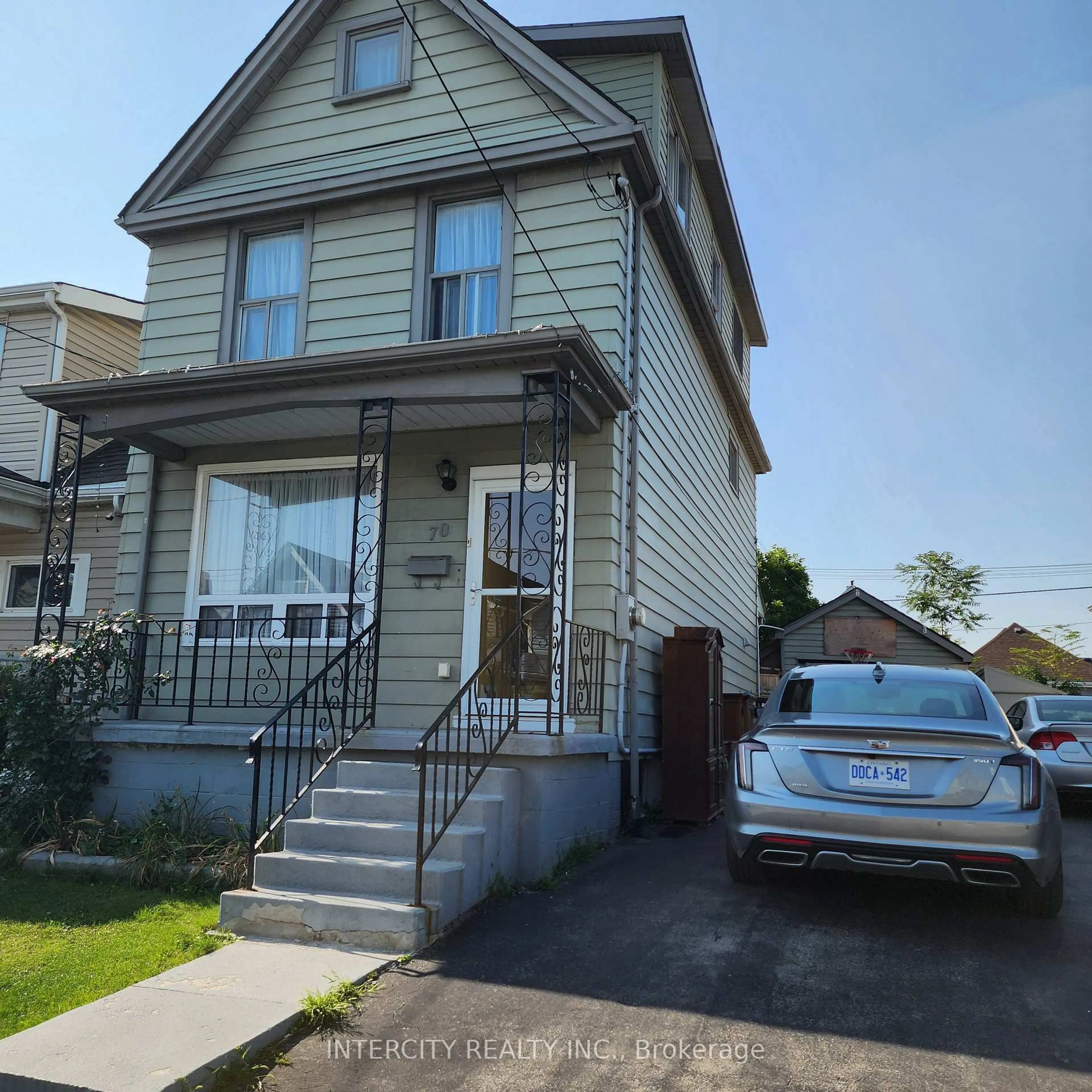 Home with vinyl exterior material, street for 70 Mayflower Ave, Hamilton Ontario L8L 2K4
