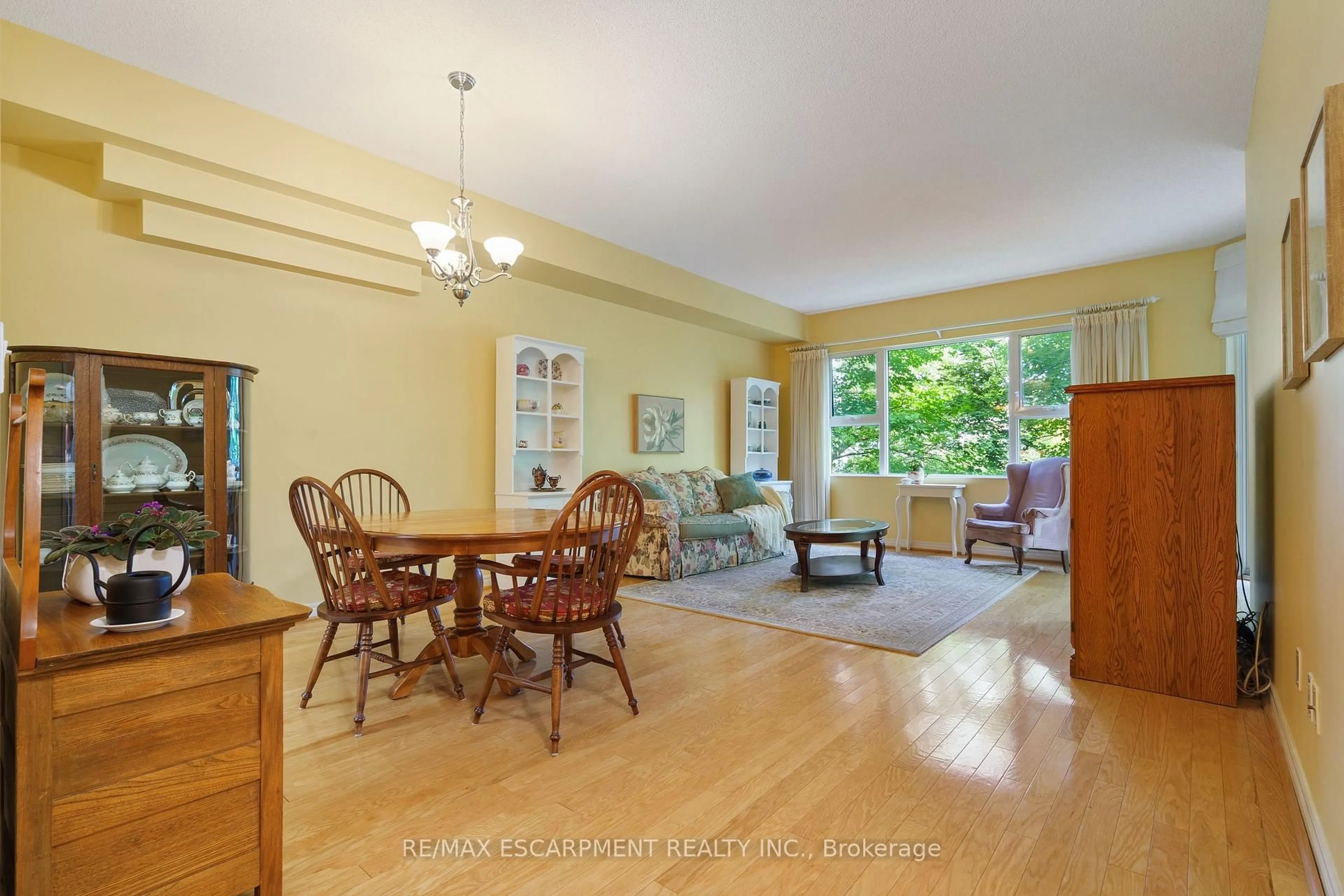 Living room with furniture, unknown for 77 Governors Rd #102, Hamilton Ontario L9H 7N8
