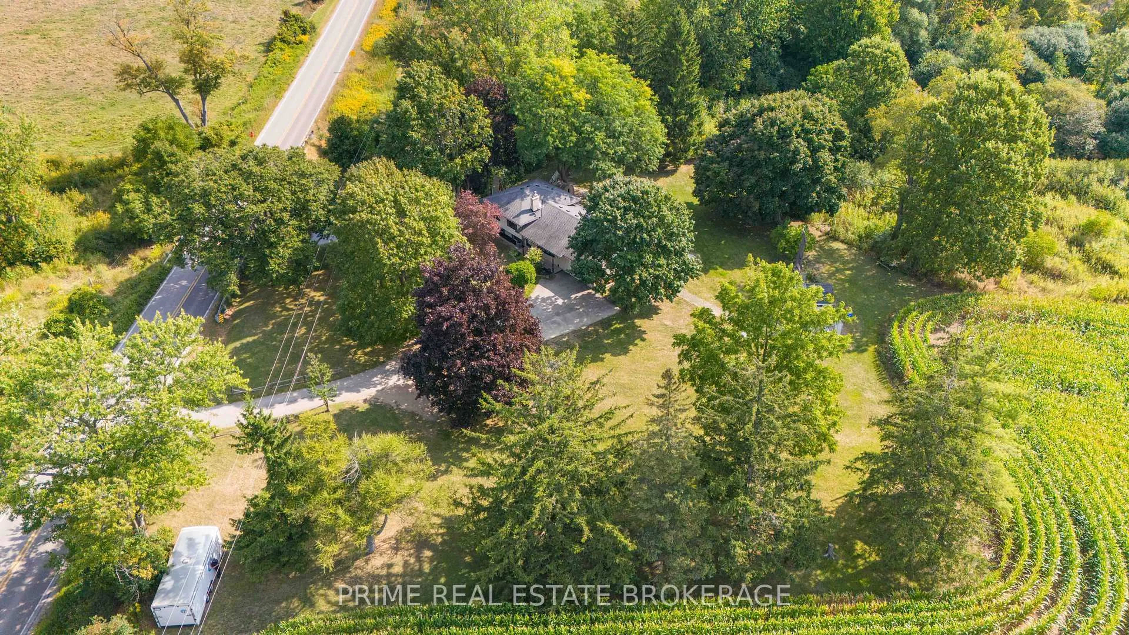 A pic from outside/outdoor area/front of a property/back of a property/a pic from drone, forest/trees view for 2141 Sunningdale Rd, London North Ontario N5X 3Y5