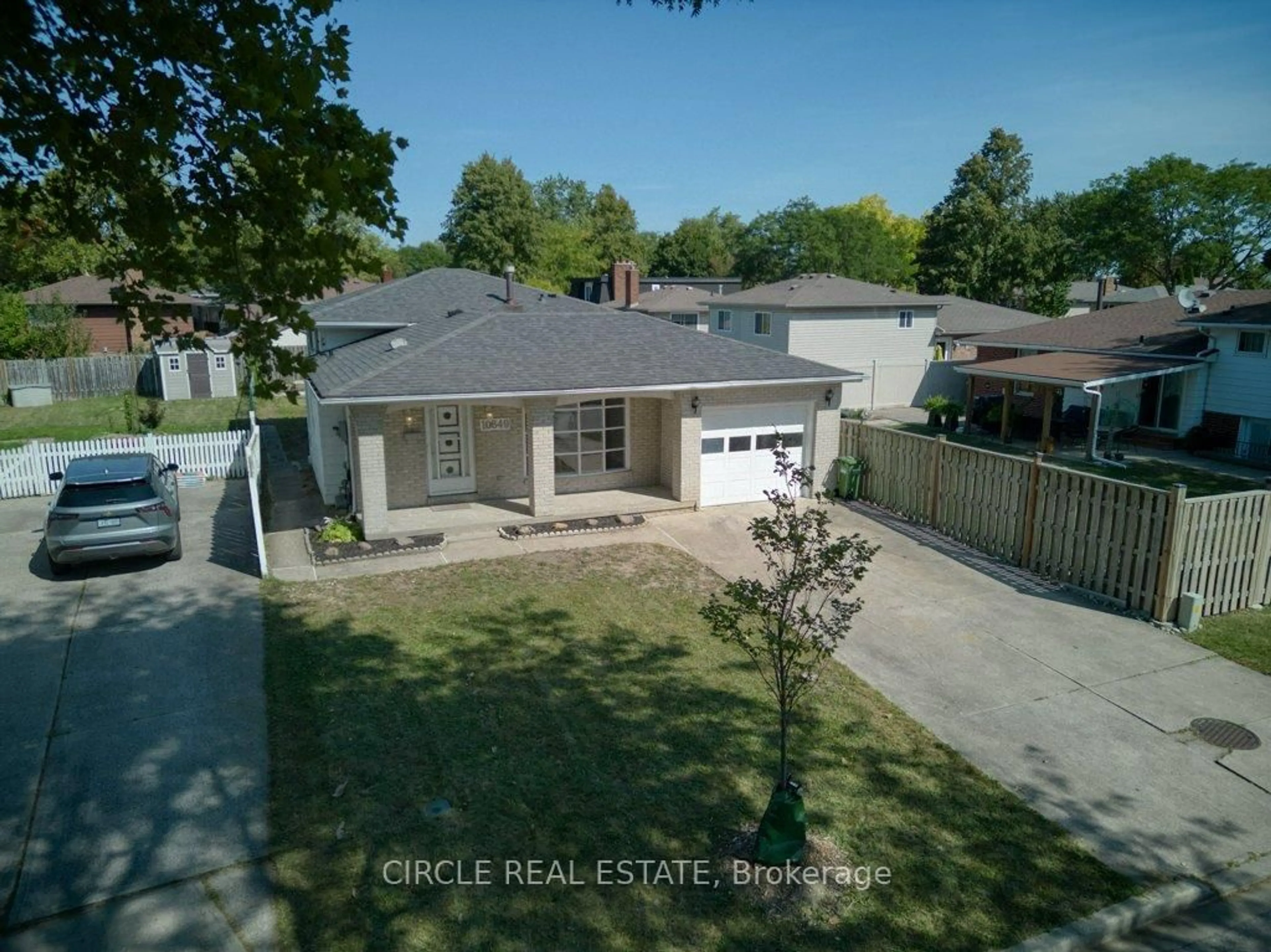 A pic from outside/outdoor area/front of a property/back of a property/a pic from drone, street for 10649 Halstead Cres, Windsor Ontario N8R 2C3