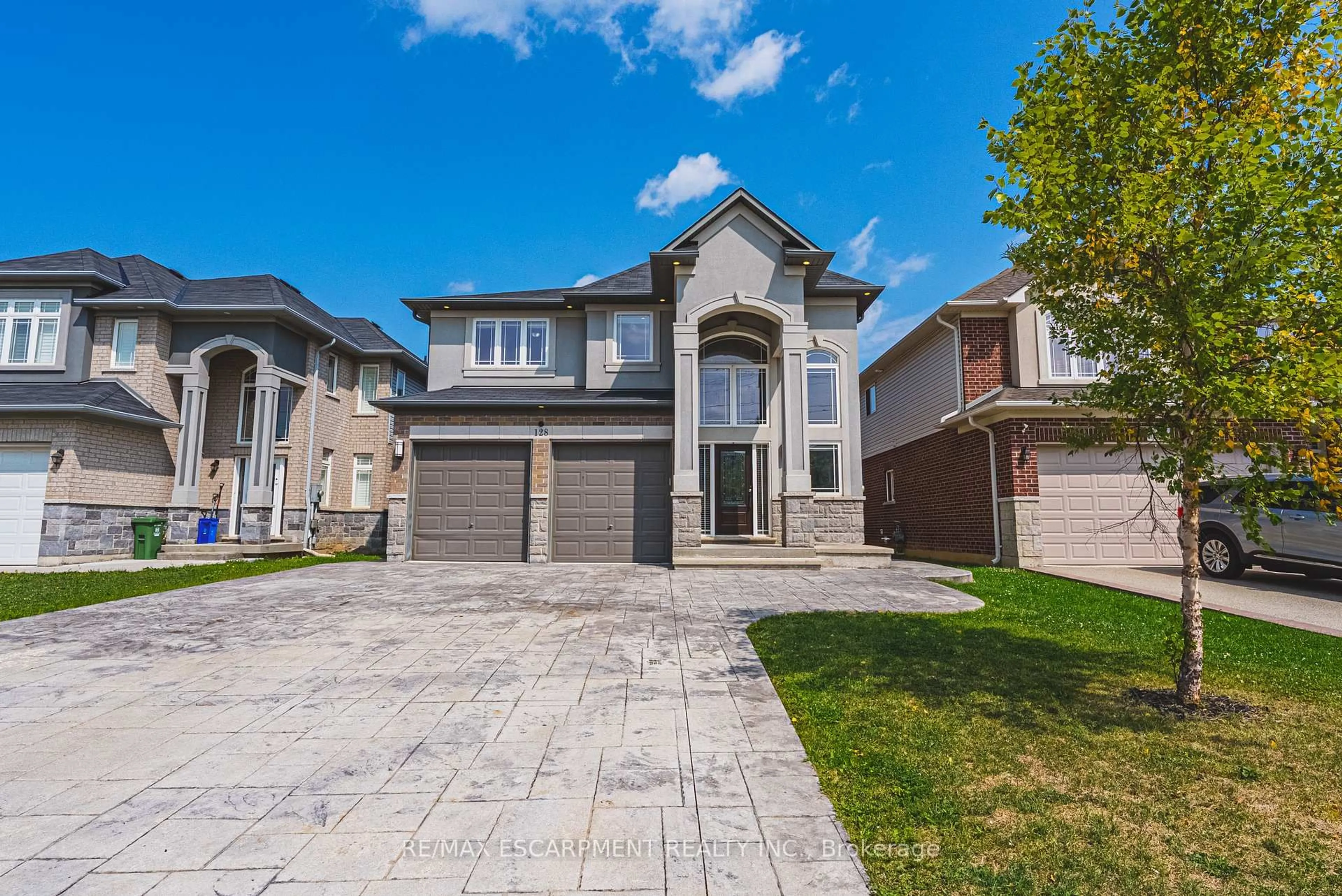 Home with brick exterior material, street for 128 Medici Lane, Hamilton Ontario L0R 1W0