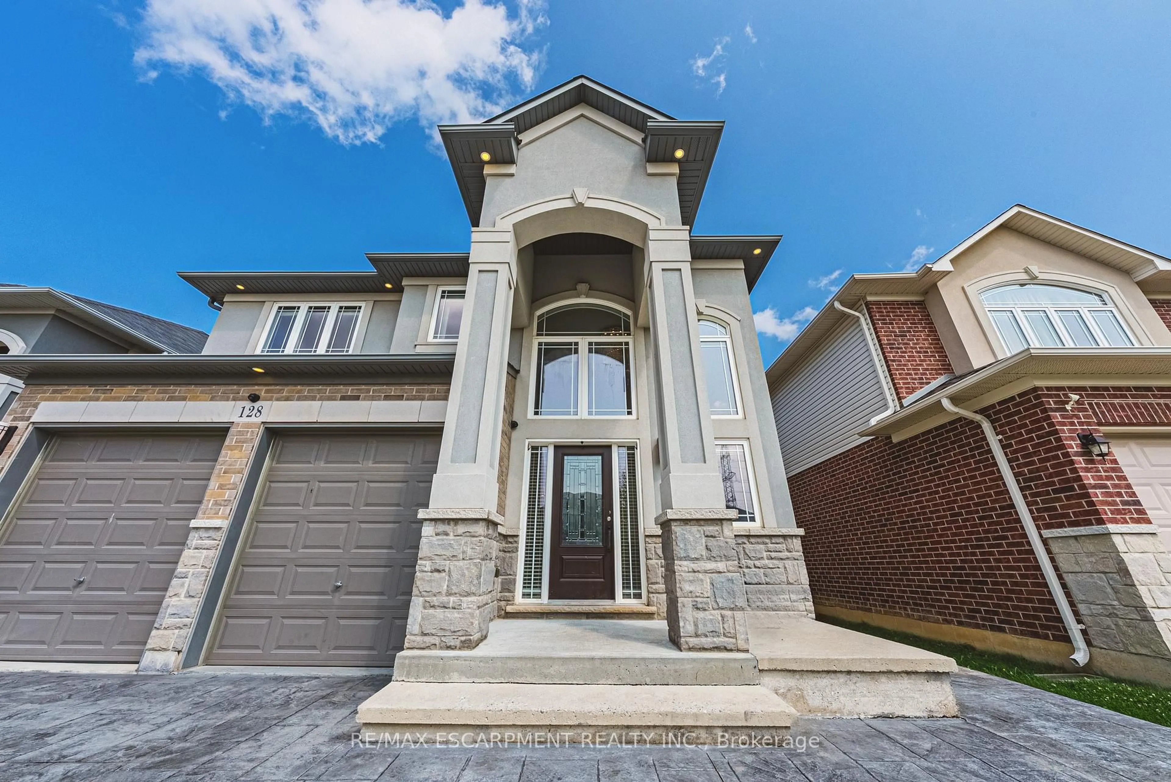 Home with brick exterior material, street for 128 Medici Lane, Hamilton Ontario L0R 1W0