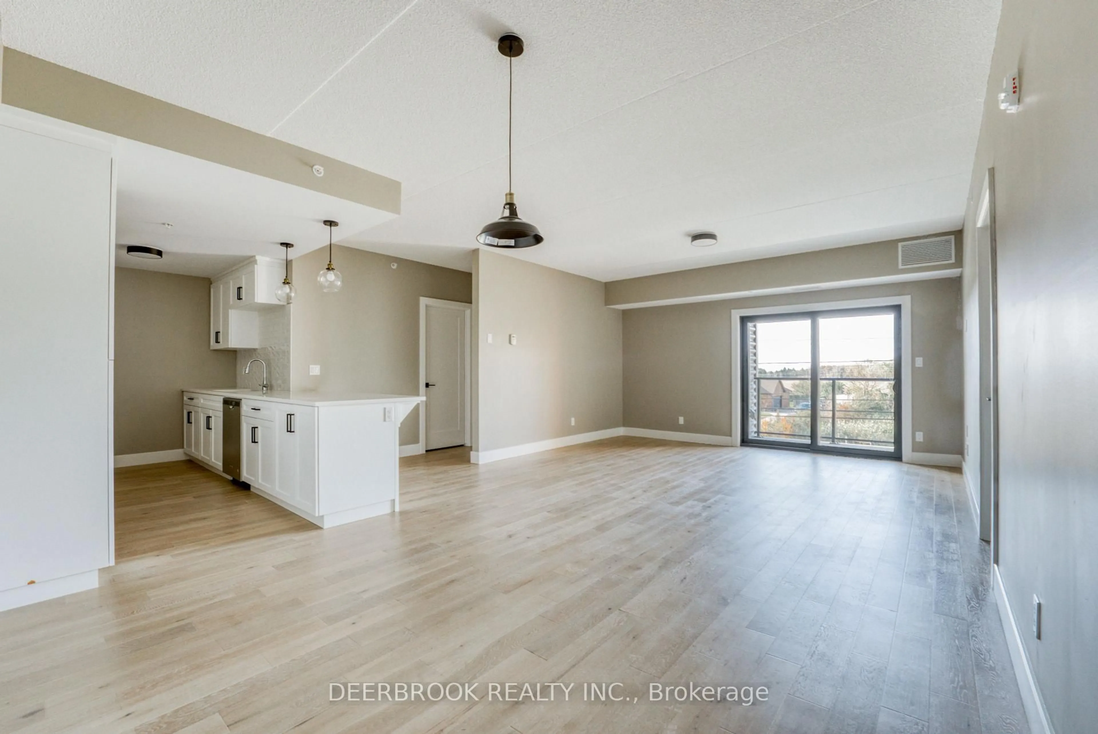 Open concept kitchen, wood/laminate floor for 4578 Huron Church Line Rd #109, LaSalle Ontario N9H 0M2