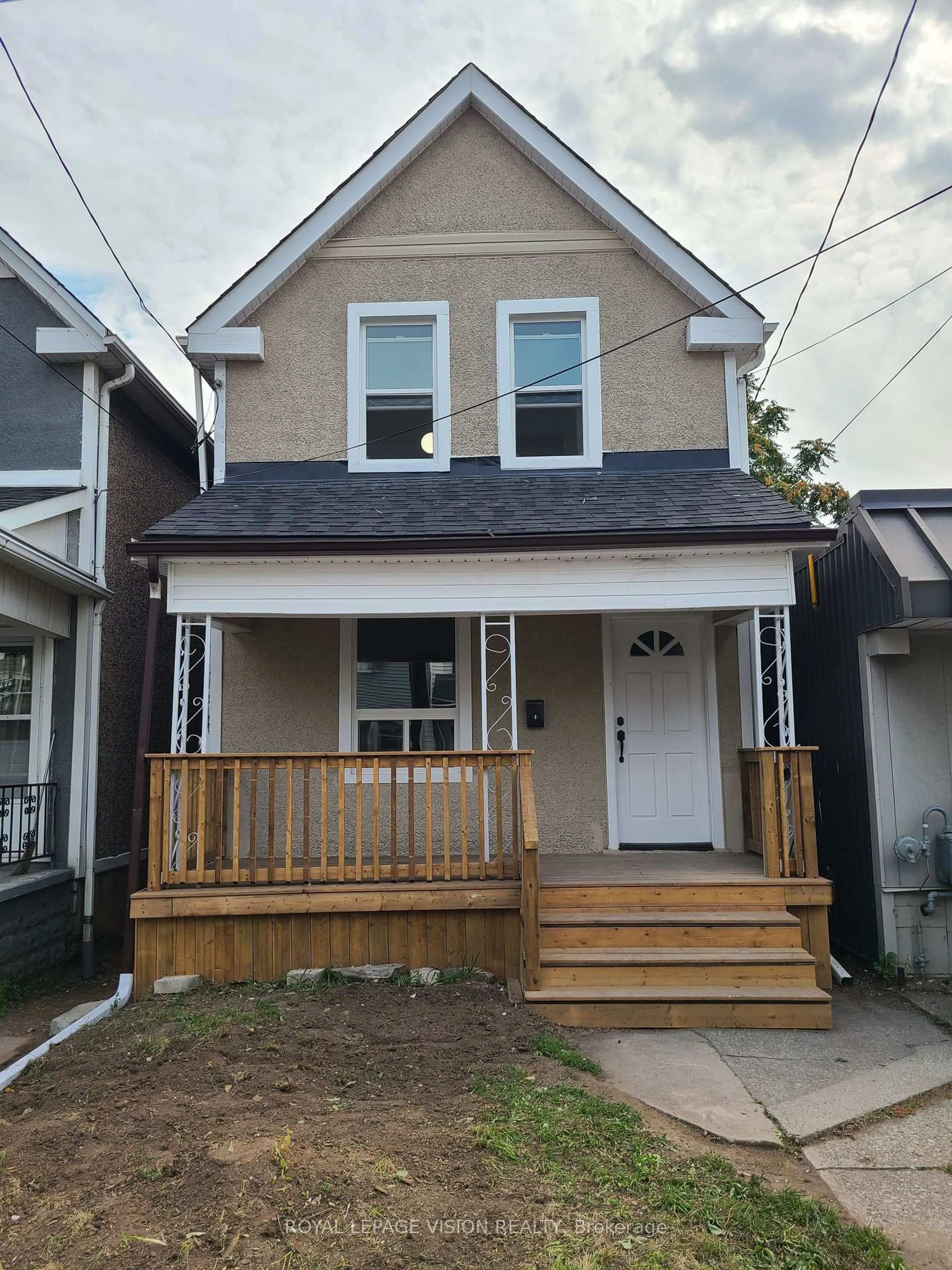 Home with vinyl exterior material, street for 56 Munroe St, Hamilton Ontario L8L 3V7