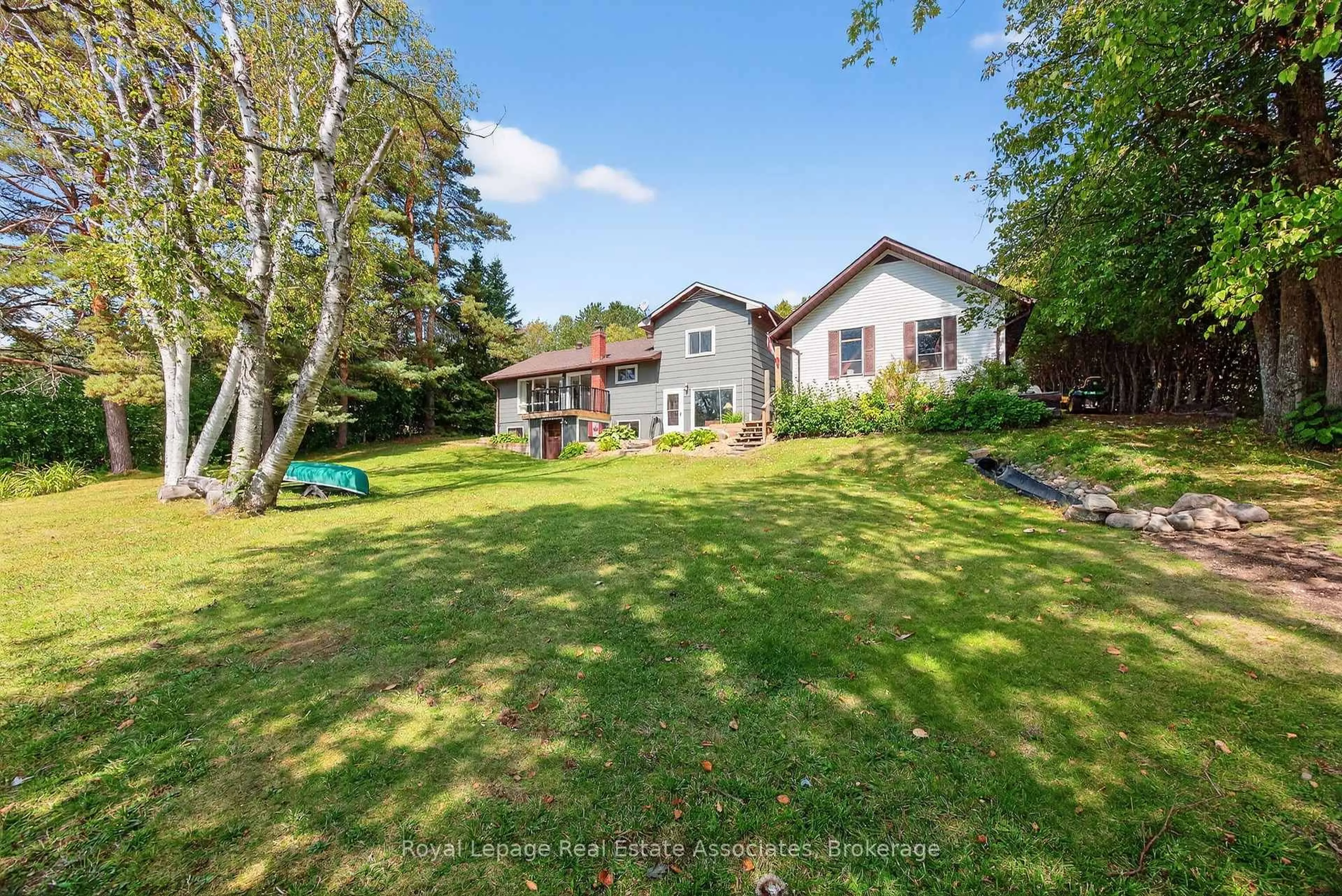 A pic from outside/outdoor area/front of a property/back of a property/a pic from drone, water/lake/river/ocean view for 389 Falcon Rd, Huntsville Ontario P1H 1N3