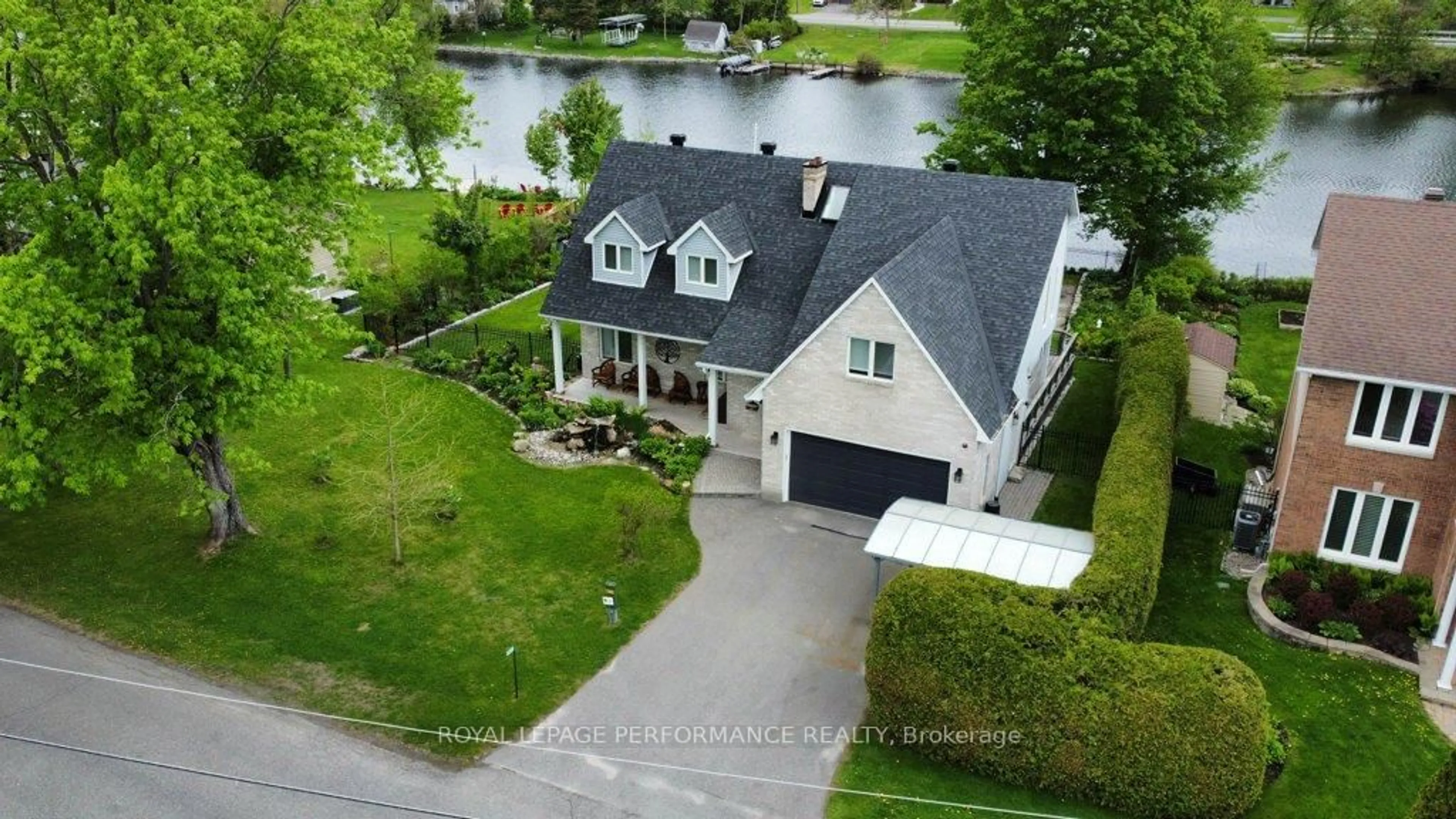 A pic from outside/outdoor area/front of a property/back of a property/a pic from drone, water/lake/river/ocean view for 6099 James Bell Dr, Manotick Ontario K4M 1B3