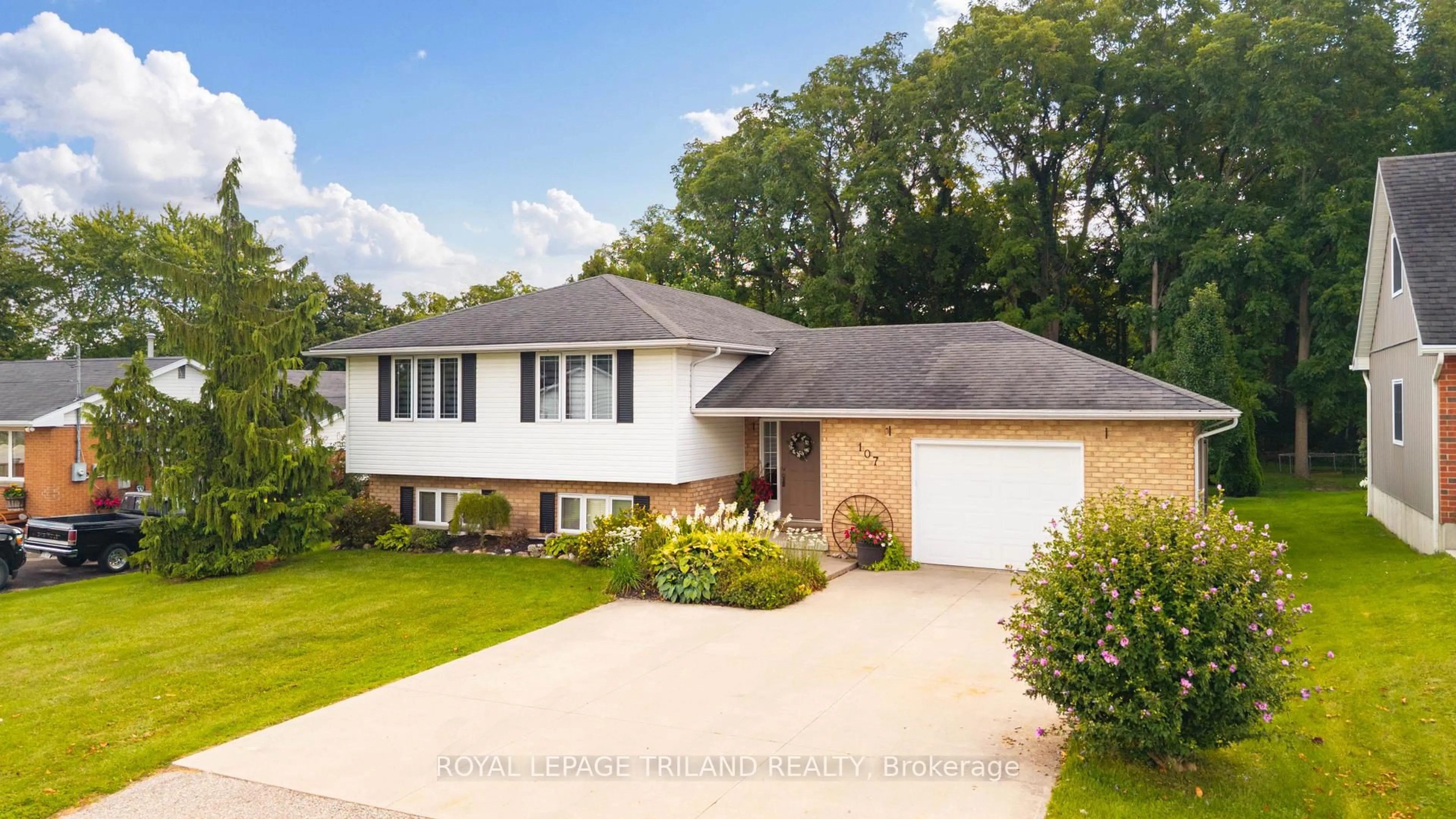 Home with vinyl exterior material, street for 107 MCKELLAR St, Southwest Middlesex Ontario N0L 1M0