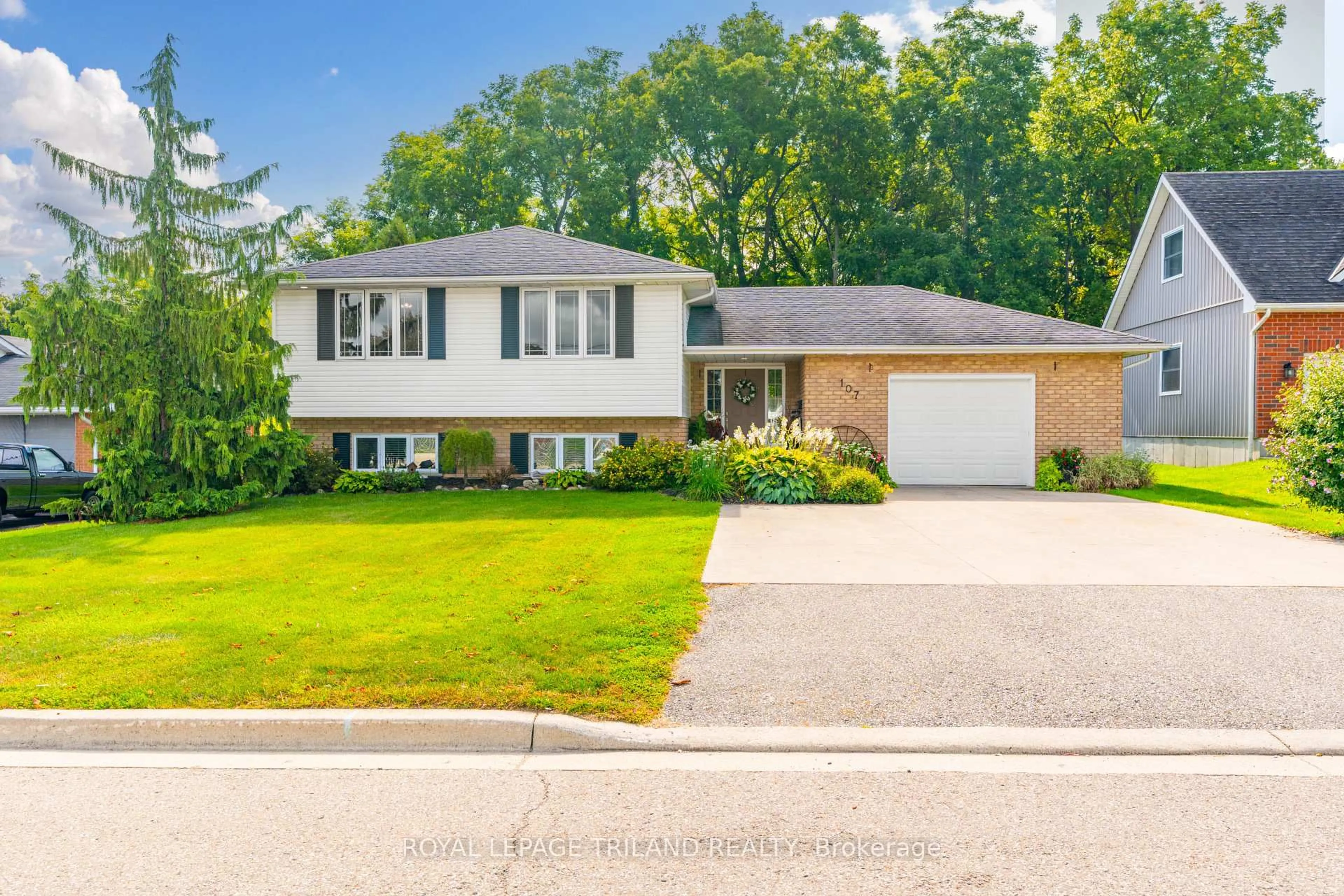 Home with vinyl exterior material, street for 107 MCKELLAR St, Southwest Middlesex Ontario N0L 1M0