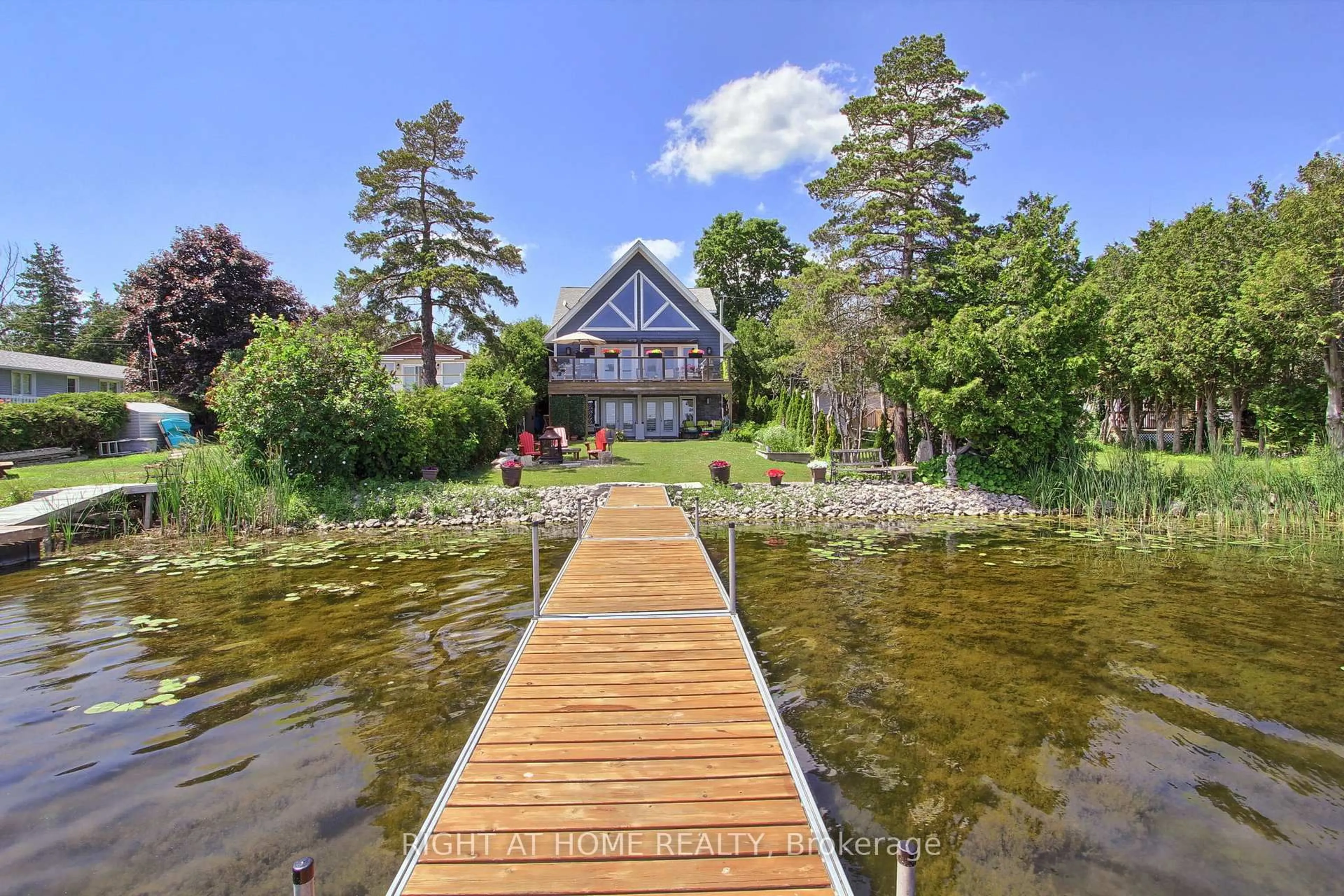 A pic from outside/outdoor area/front of a property/back of a property/a pic from drone, water/lake/river/ocean view for 26 Beach Rd, Kawartha Lakes Ontario K0M 2C0