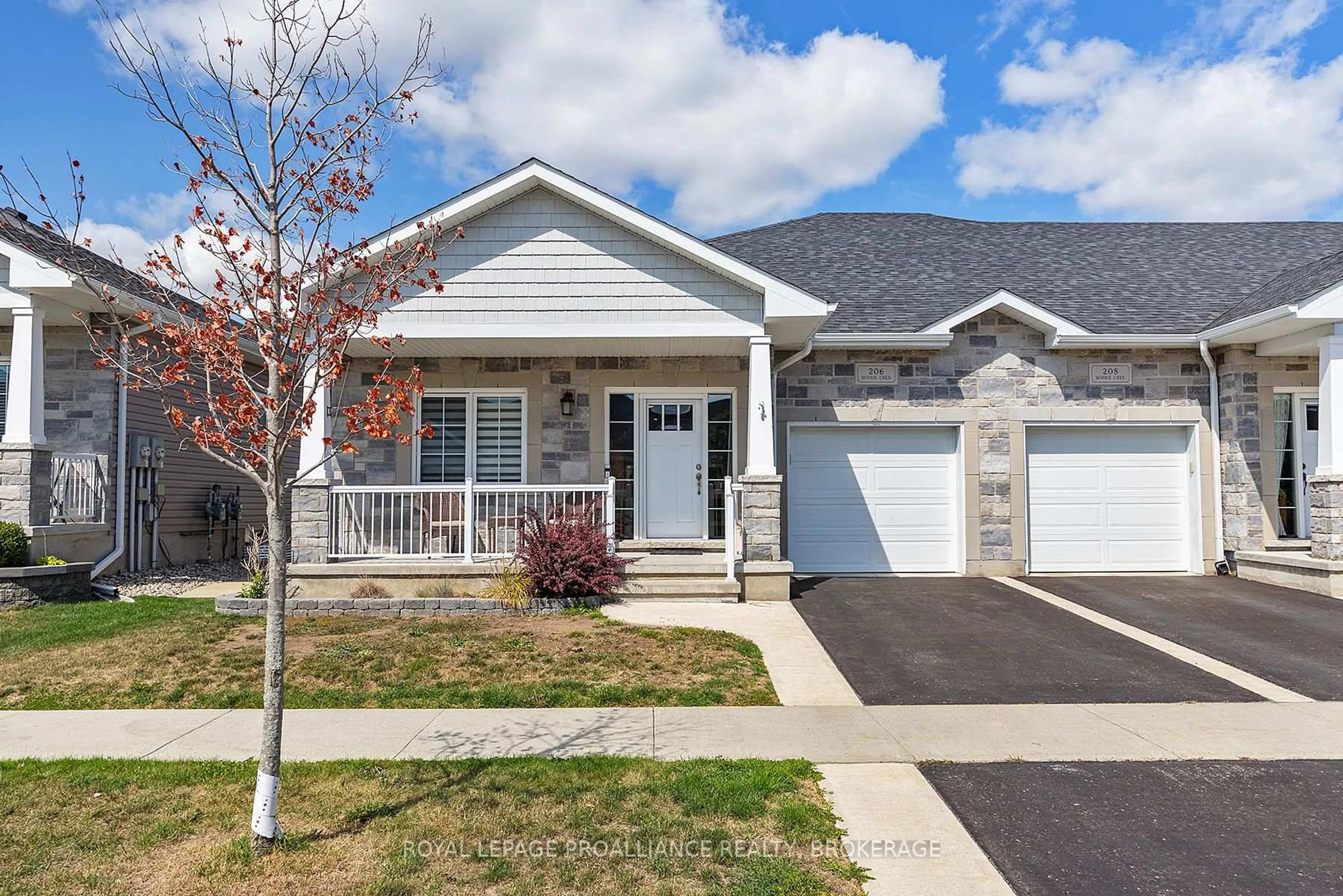 Home with vinyl exterior material, street for 206 Sorbie Cres, Loyalist Ontario K7N 0B8