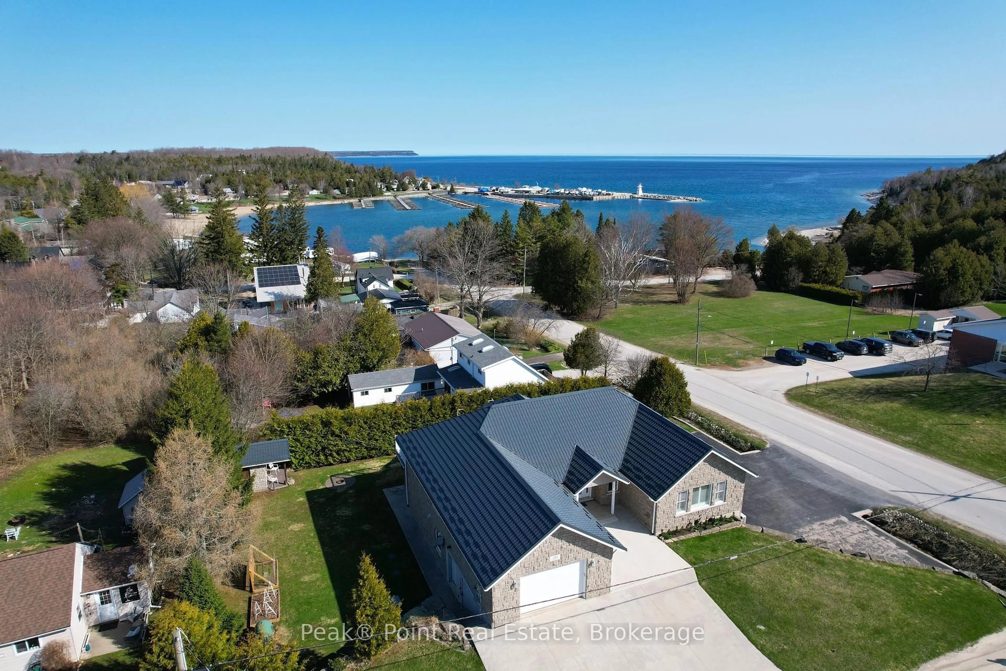 A pic from outside/outdoor area/front of a property/back of a property/a pic from drone, water/lake/river/ocean view for 20 Moore St, Northern Bruce Peninsula Ontario N0H 1W0