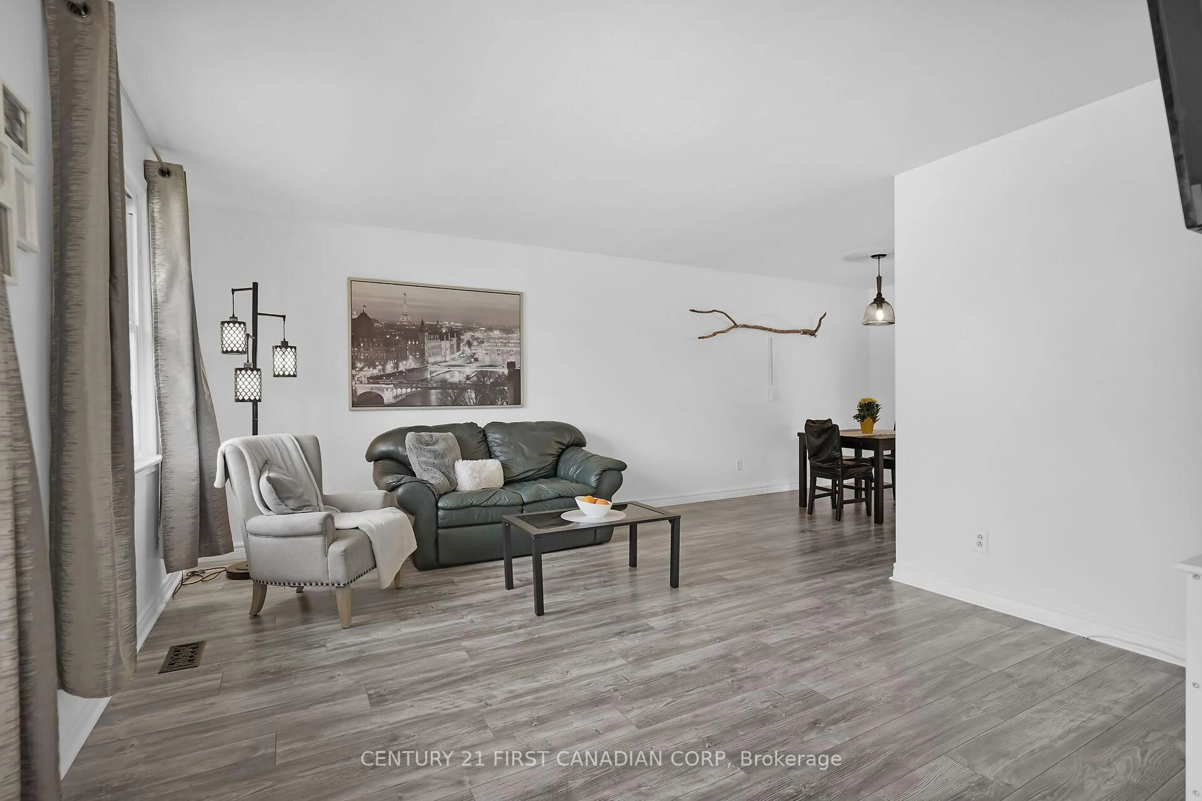 Living room with furniture, wood/laminate floor for 23 Gregory Pl, St. Thomas Ontario N5R 4S4