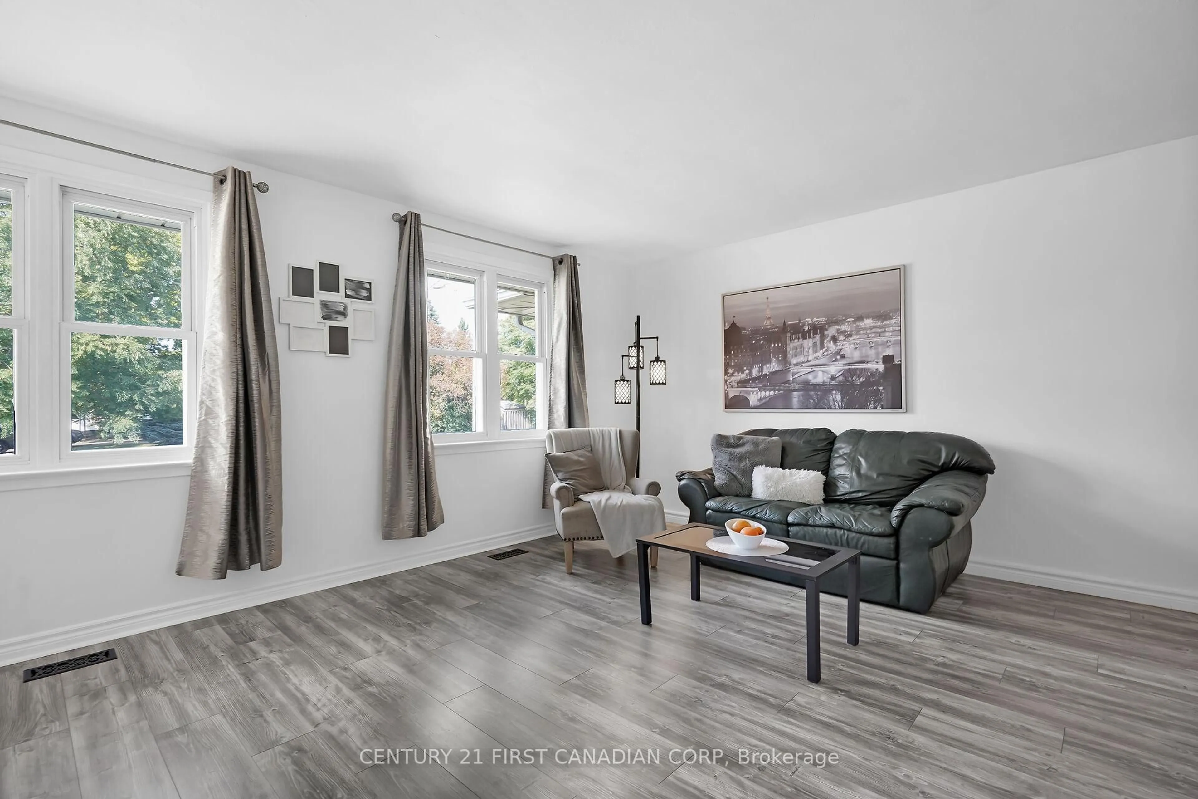 Living room with furniture, wood/laminate floor for 23 Gregory Pl, St. Thomas Ontario N5R 4S4