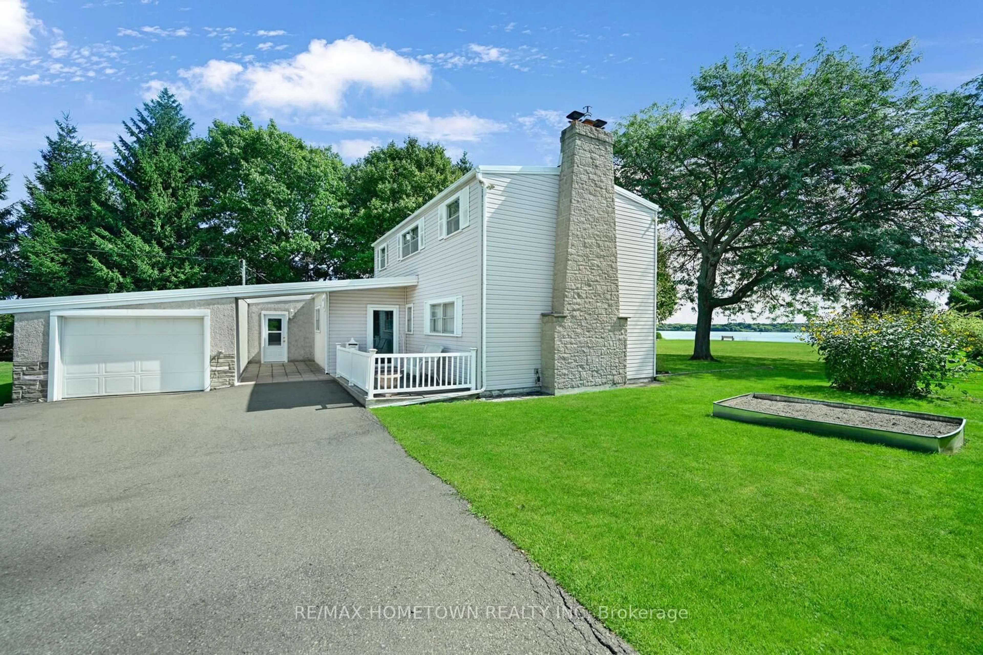 A pic from outside/outdoor area/front of a property/back of a property/a pic from drone, water/lake/river/ocean view for 401 County Road 2 Rd, Edwardsburgh/Cardinal Ontario K0E 1E0