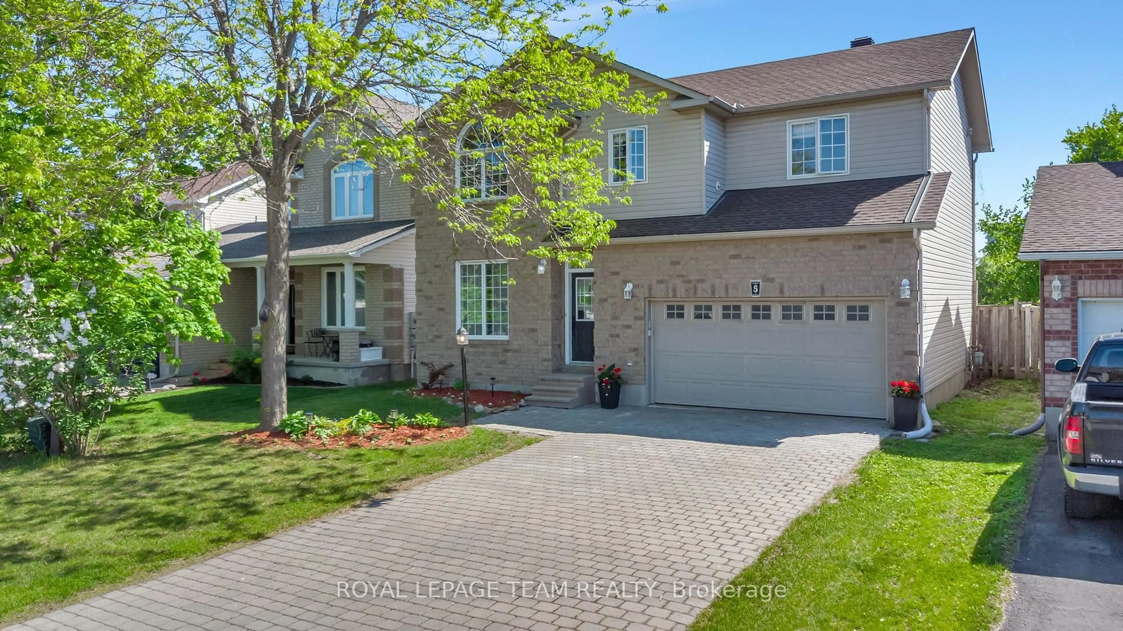 Home with brick exterior material, street for 5 Sundew Crt, Stittsville Ontario K2S 1Z5
