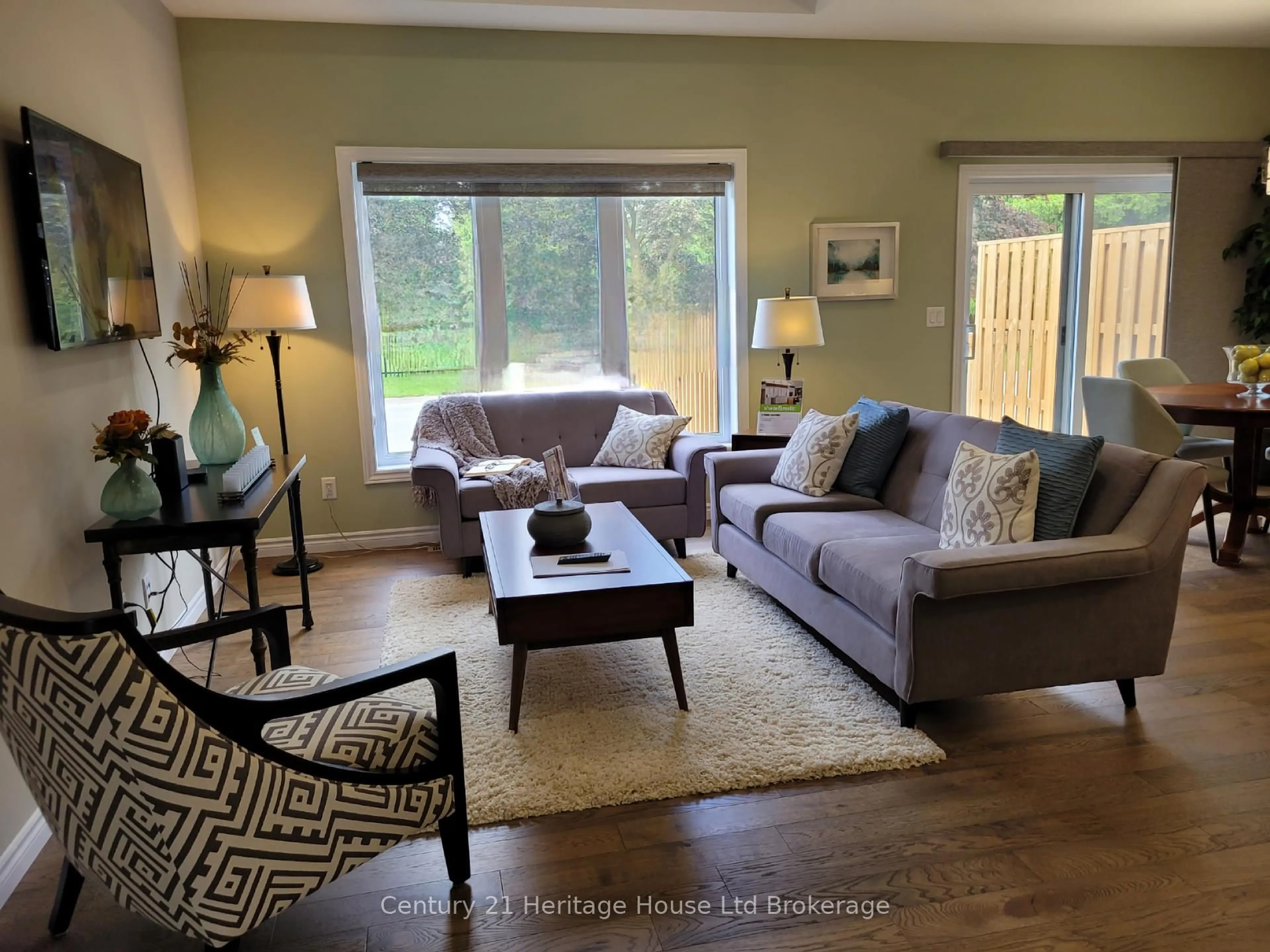 Living room with furniture, wood/laminate floor for 22 Matheson Cres, East Zorra-Tavistock Ontario N0J 1M0