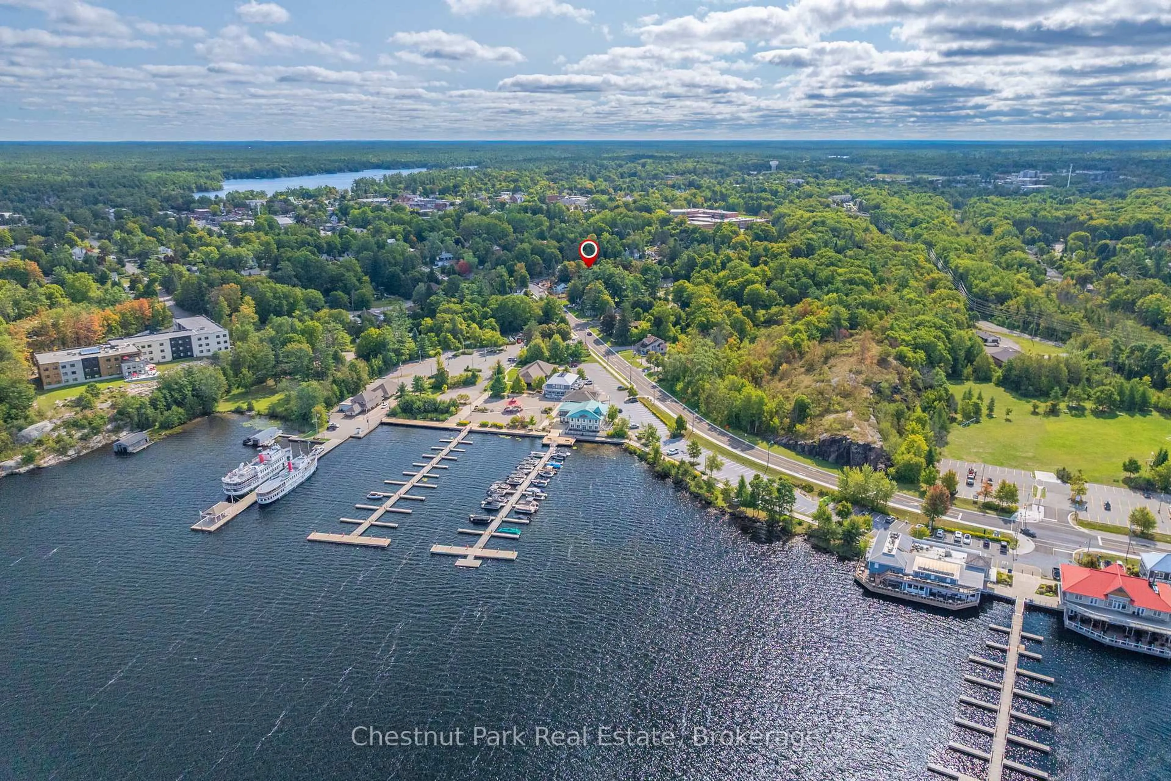 A pic from outside/outdoor area/front of a property/back of a property/a pic from drone, water/lake/river/ocean view for 615 Bay St, Gravenhurst Ontario P1P 1G8
