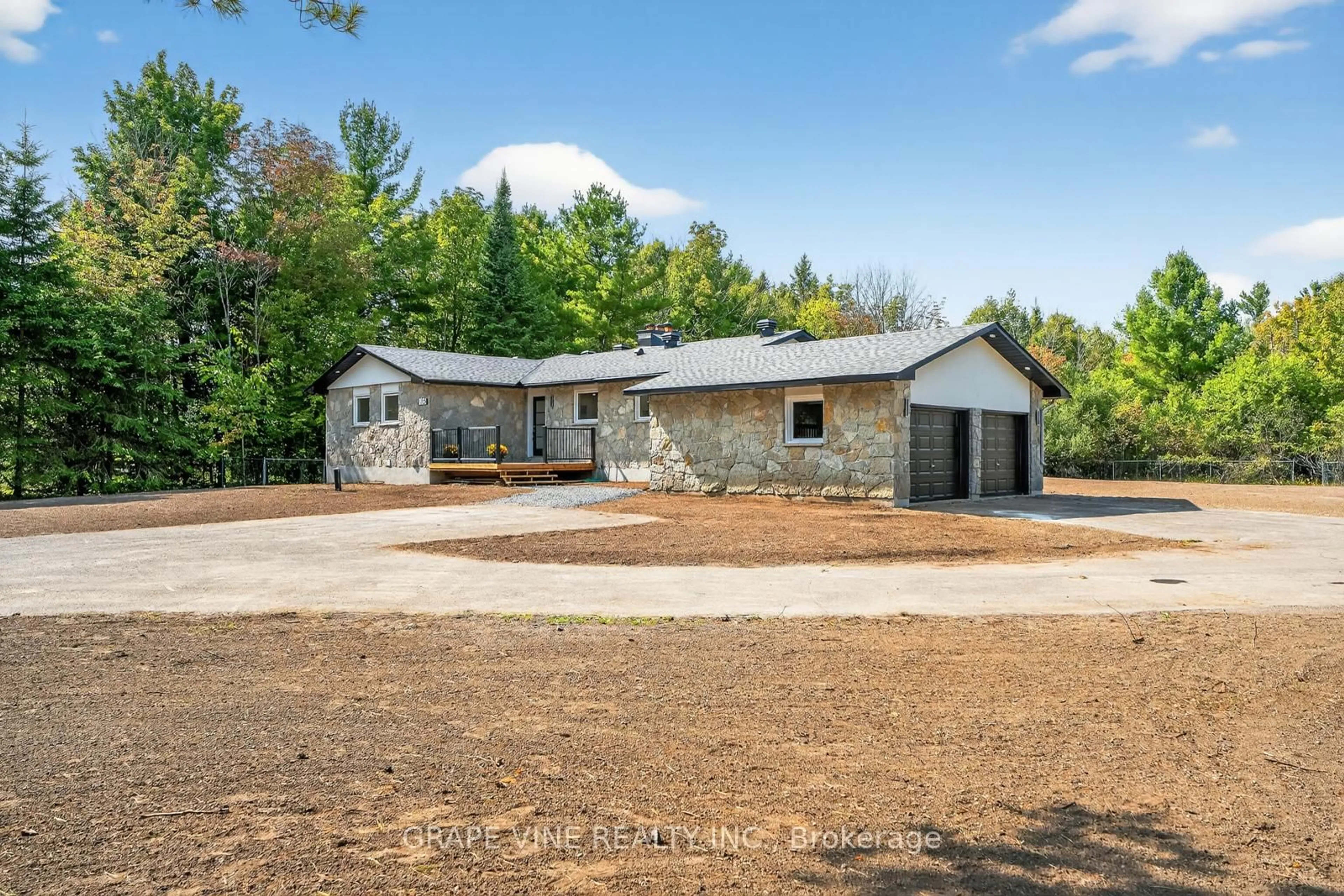 A pic from outside/outdoor area/front of a property/back of a property/a pic from drone, unknown for 135 Manion Rd, Carp Ontario K0A 1L0