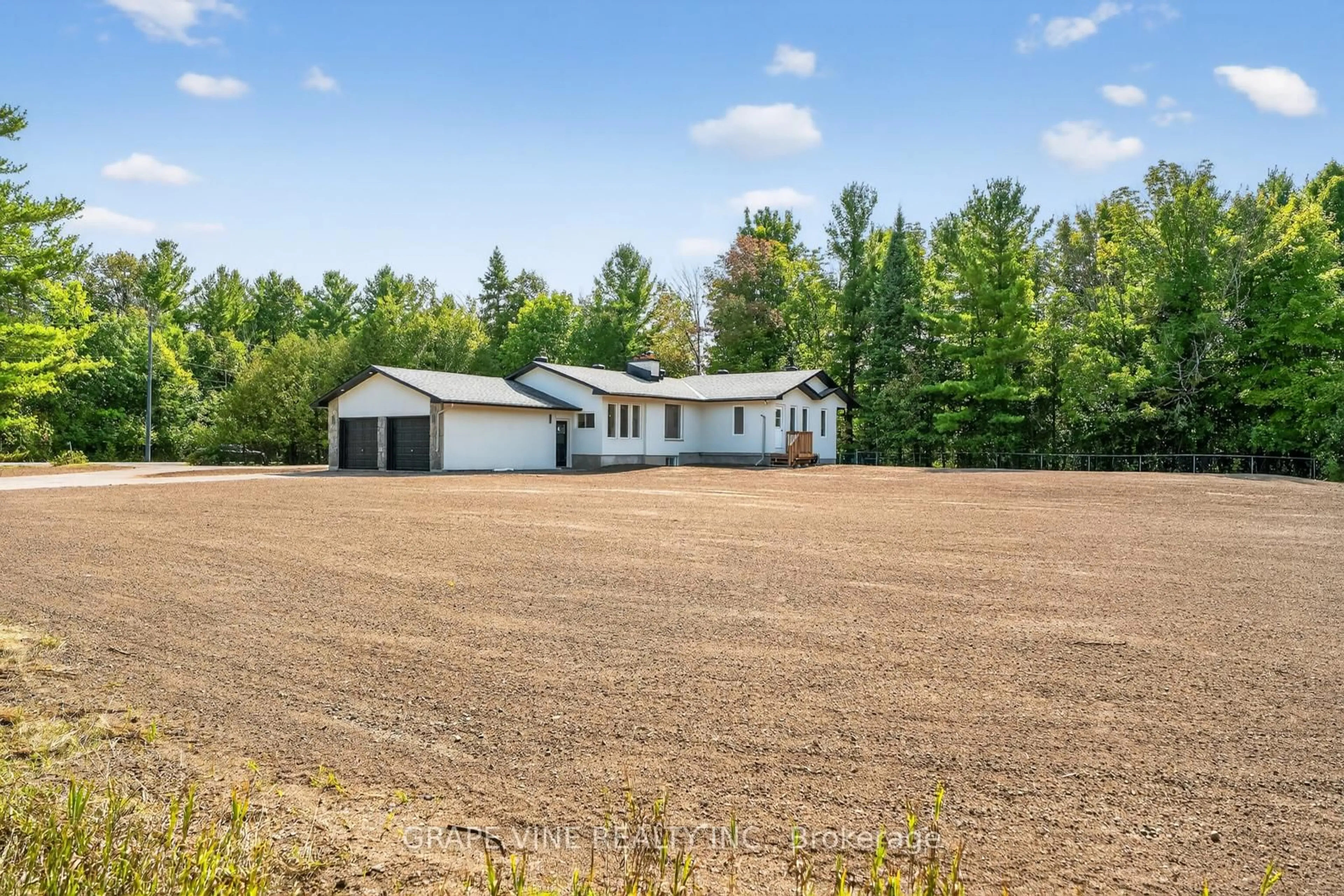 A pic from outside/outdoor area/front of a property/back of a property/a pic from drone, unknown for 135 Manion Rd, Carp Ontario K0A 1L0