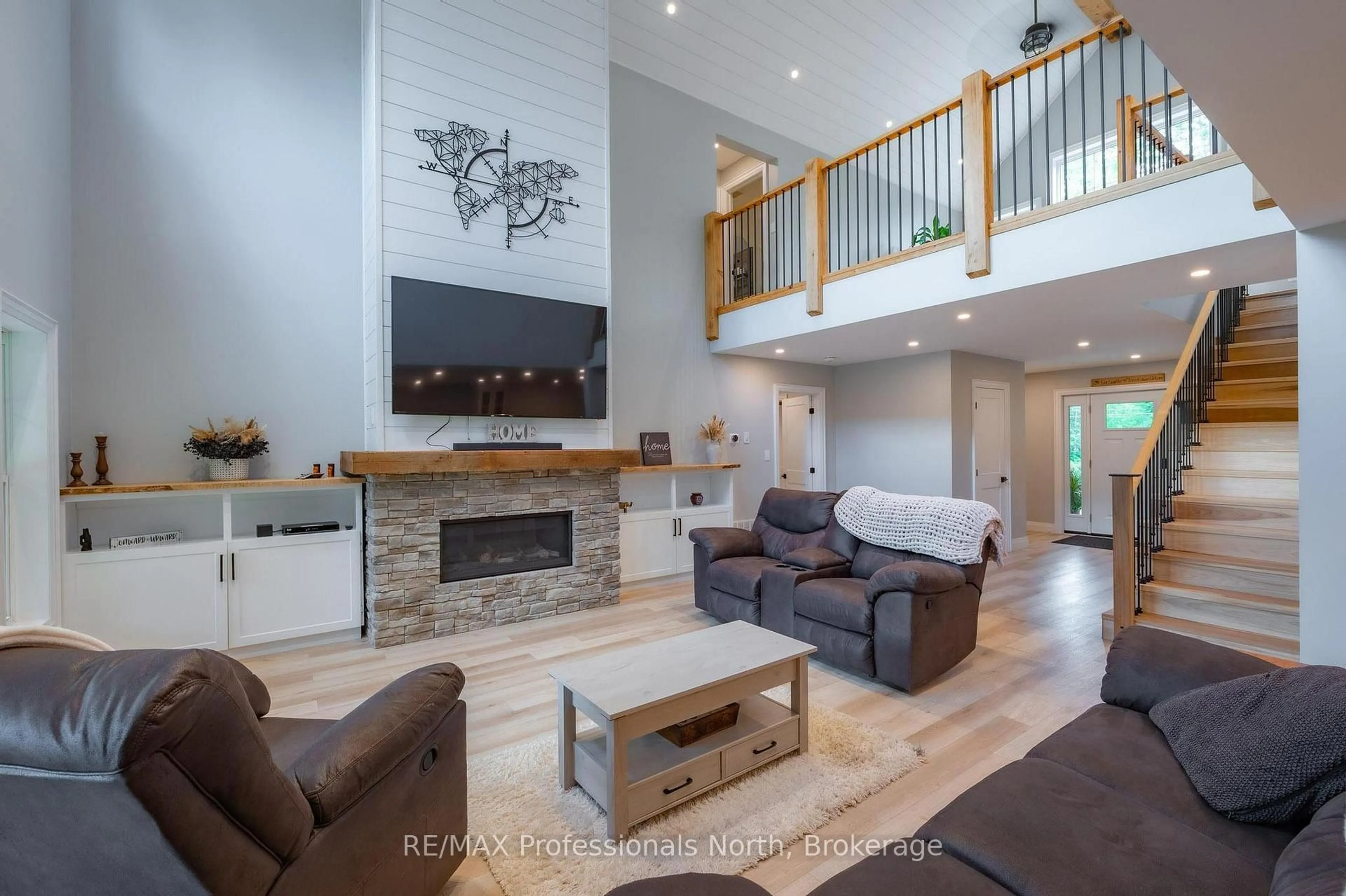 Living room with furniture, wood/laminate floor for 1677 Hospitality Rd, Minden Hills Ontario K0M 2K0