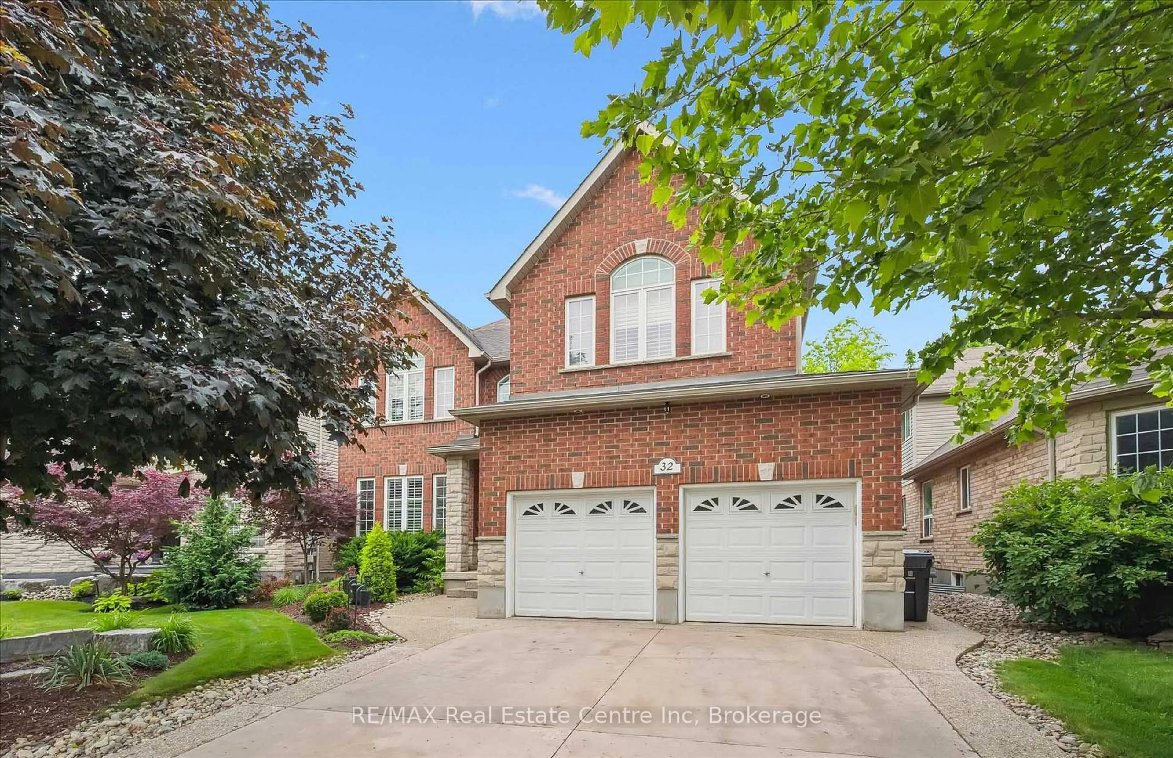 Home with brick exterior material, street for 32 Frasson Dr, Guelph Ontario N1E 7J9