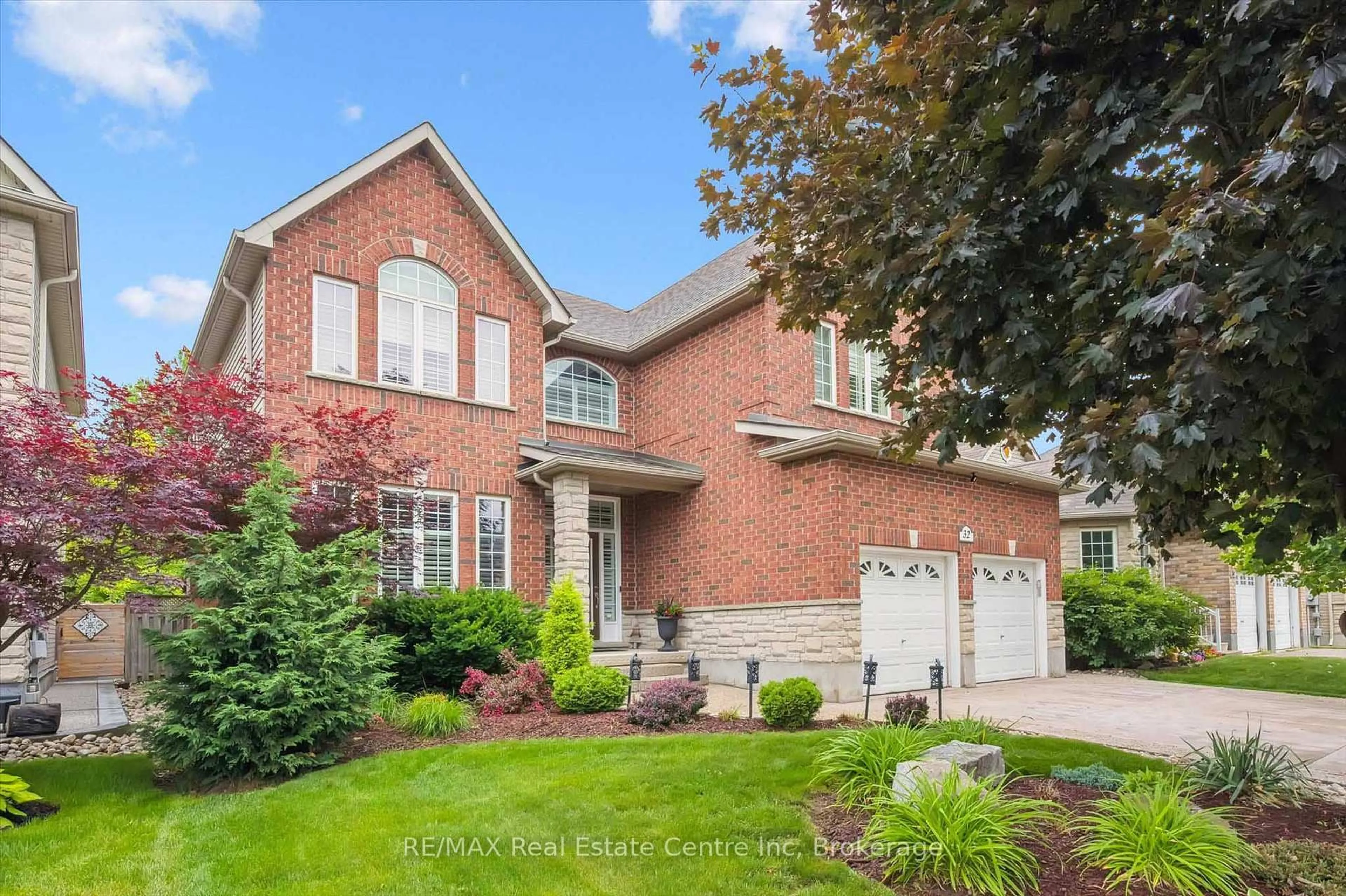Home with brick exterior material, street for 32 Frasson Dr, Guelph Ontario N1E 7J9