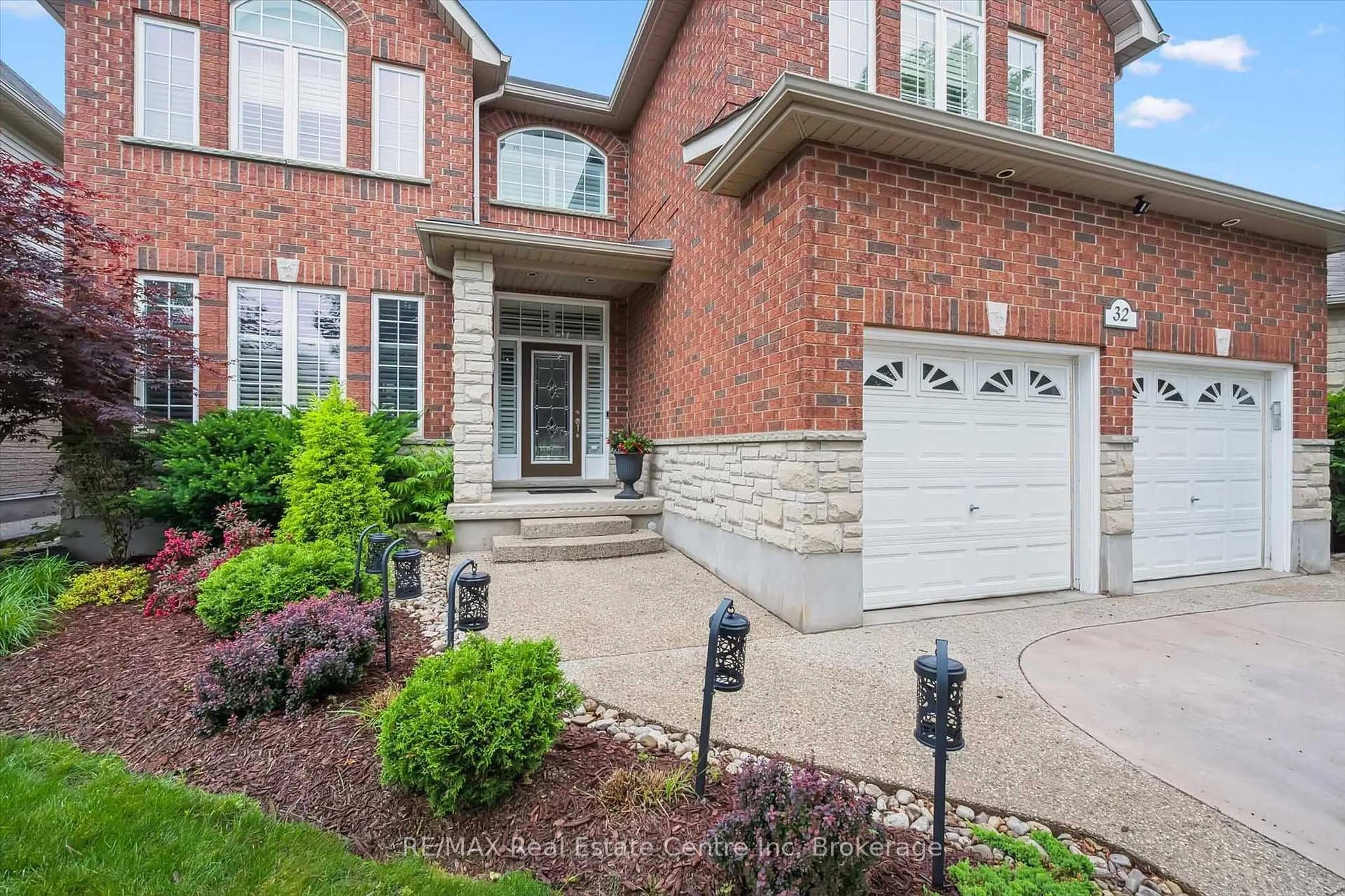Home with brick exterior material, street for 32 Frasson Dr, Guelph Ontario N1E 7J9