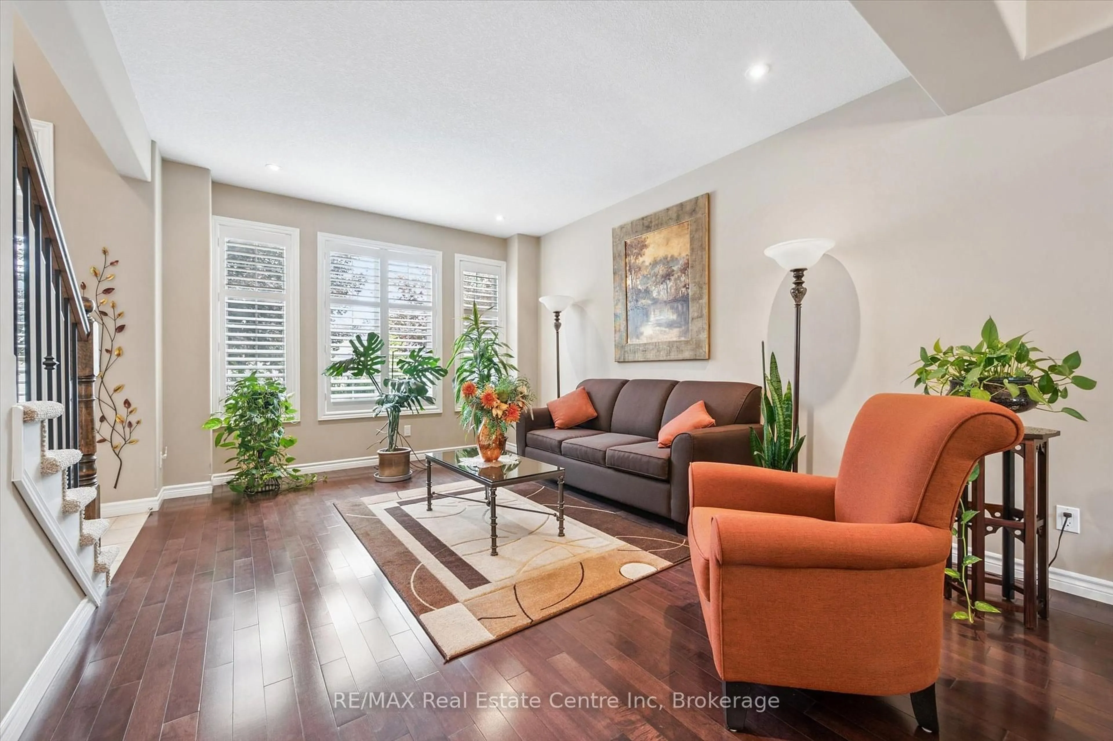 Living room with furniture, wood/laminate floor for 32 Frasson Dr, Guelph Ontario N1E 7J9