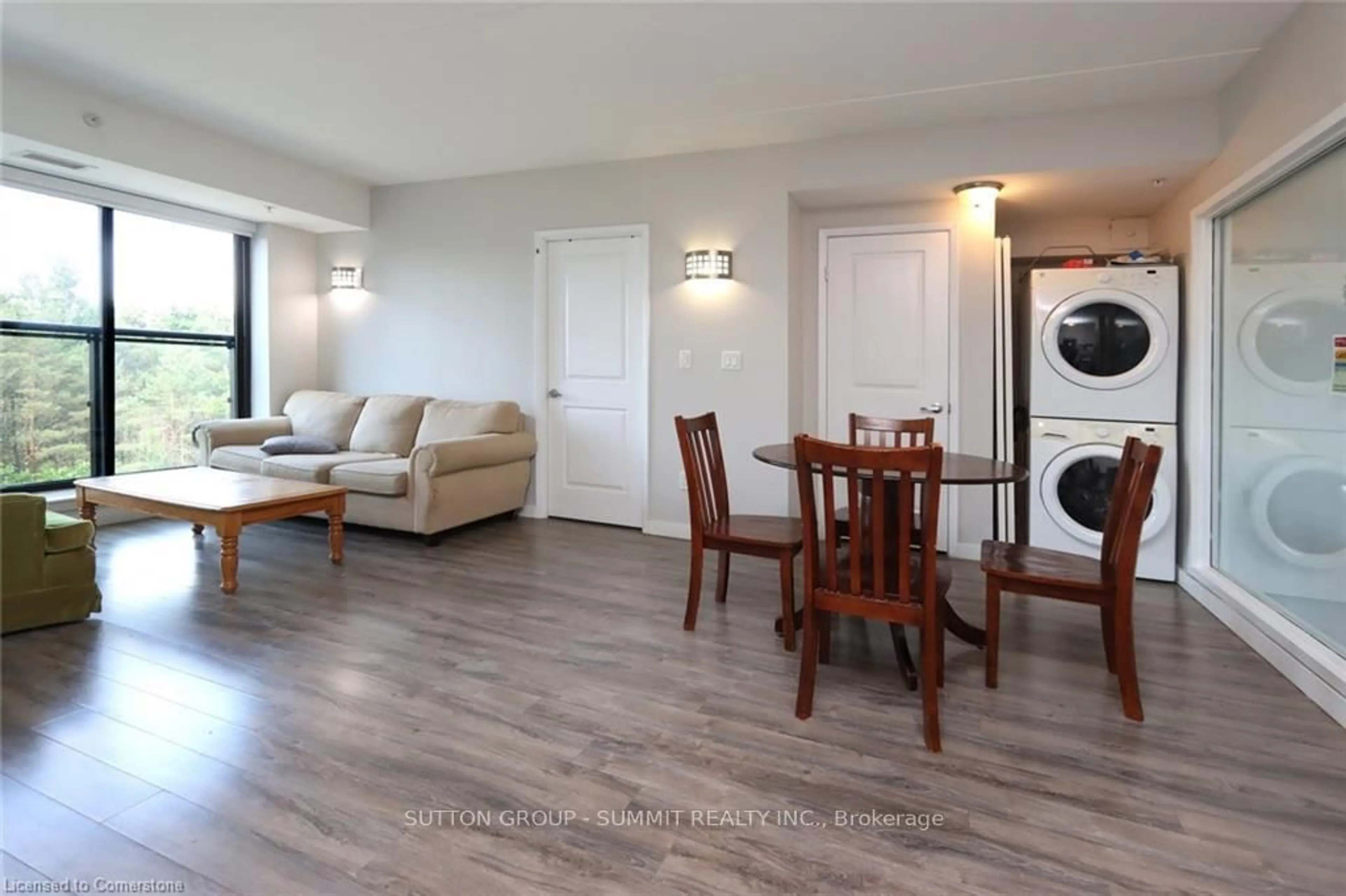 Living room with furniture, wood/laminate floor for 1291 Gordon St #216, Guelph Ontario N1L 0M5