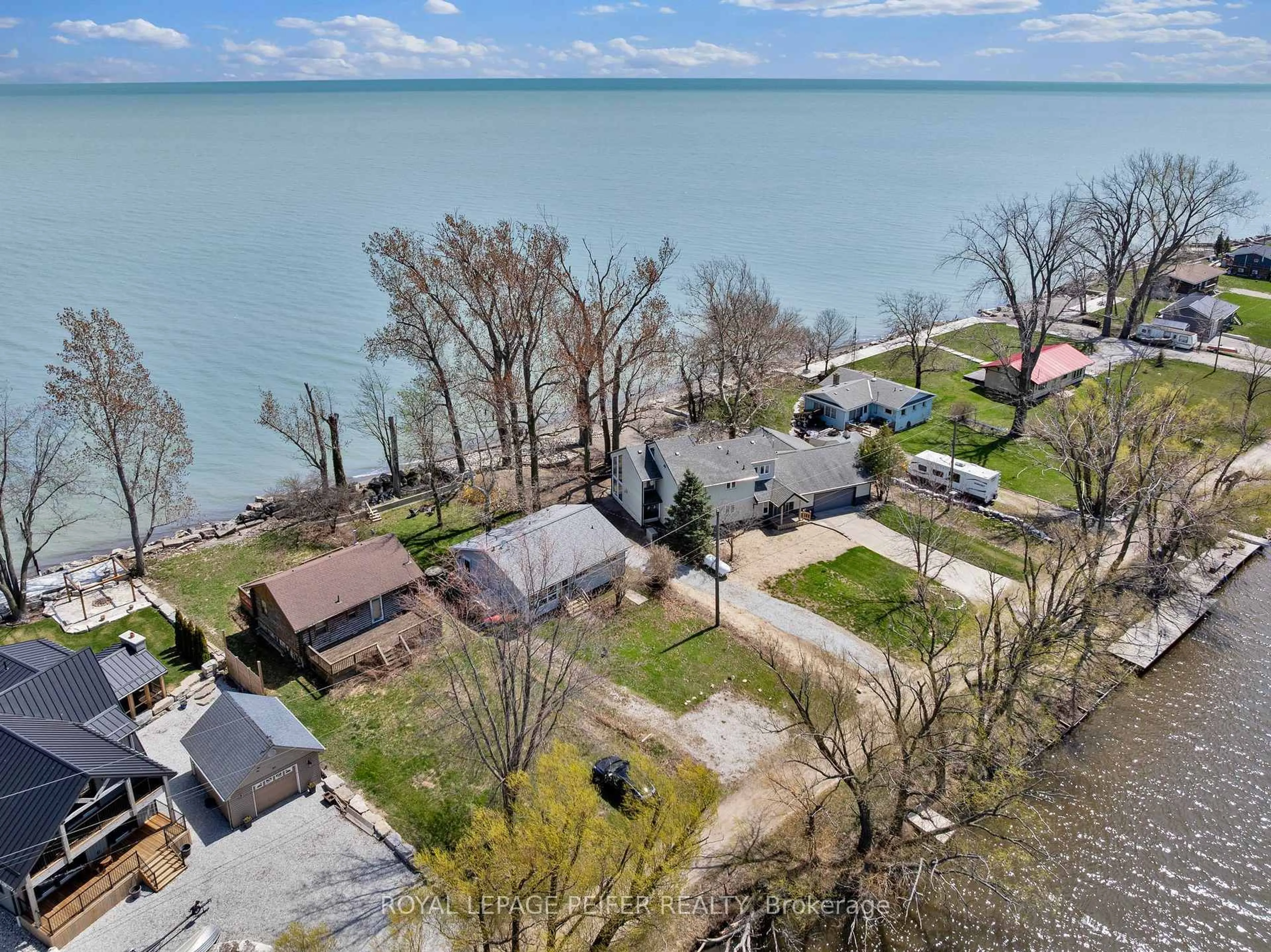 A pic from outside/outdoor area/front of a property/back of a property/a pic from drone, water/lake/river/ocean view for 83 Marentette Beach Rd, Leamington Ontario N8H 3V7