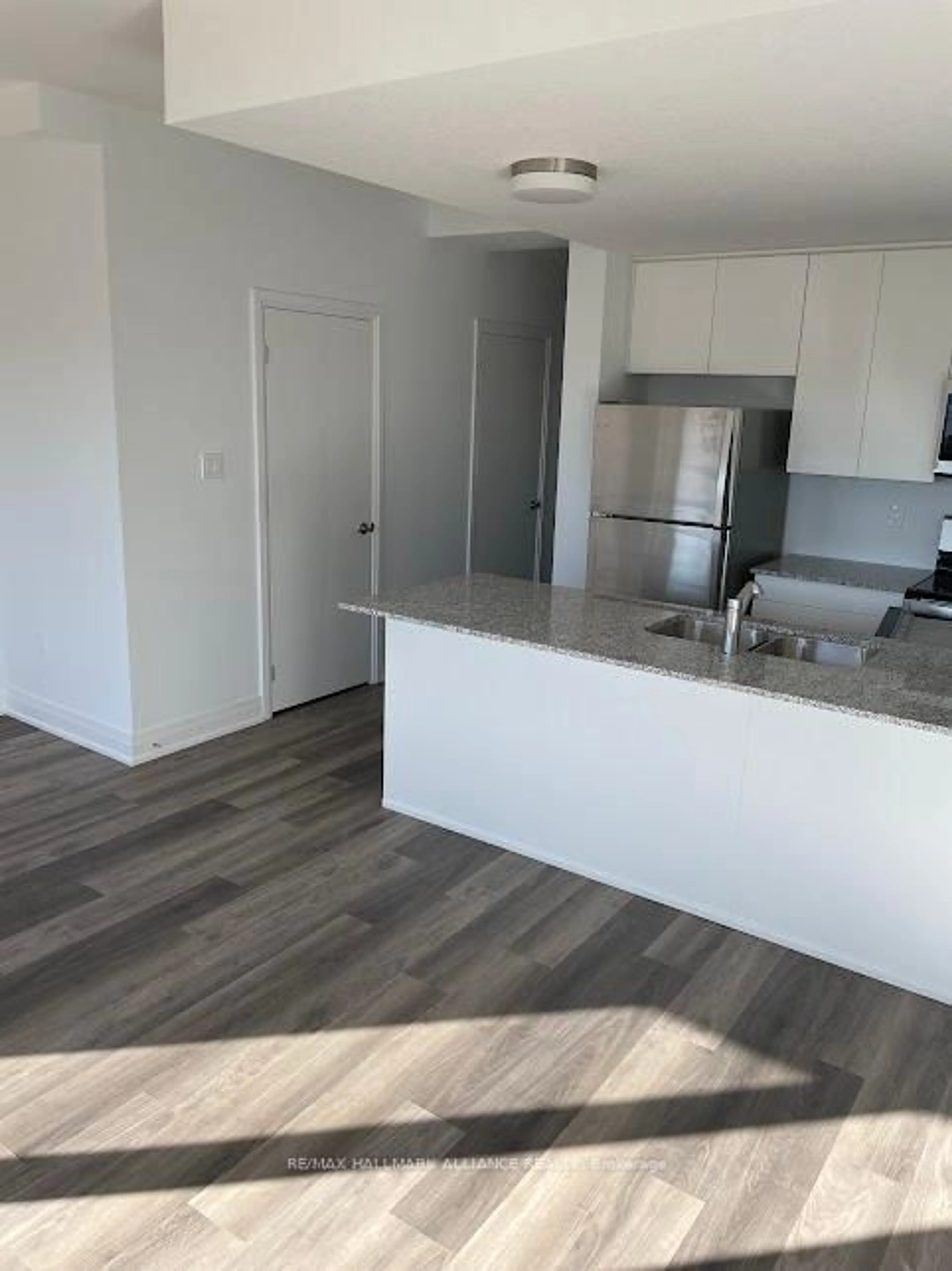 Open concept kitchen, wood/laminate floor for 38 Steele Cres #30, Guelph Ontario N1E 0S7