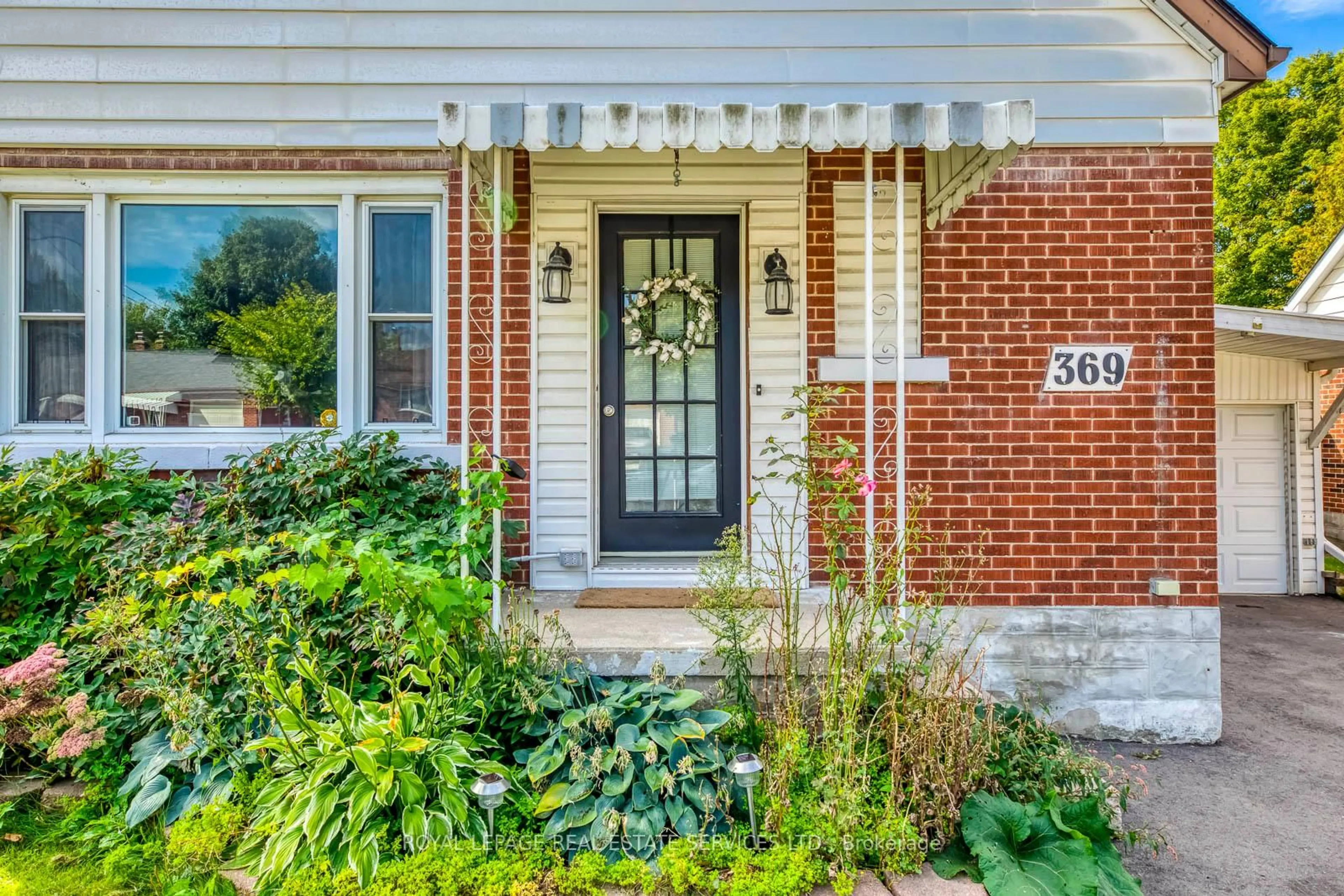 Home with brick exterior material, street for 369 Mill St, Kitchener Ontario N2M 3R9