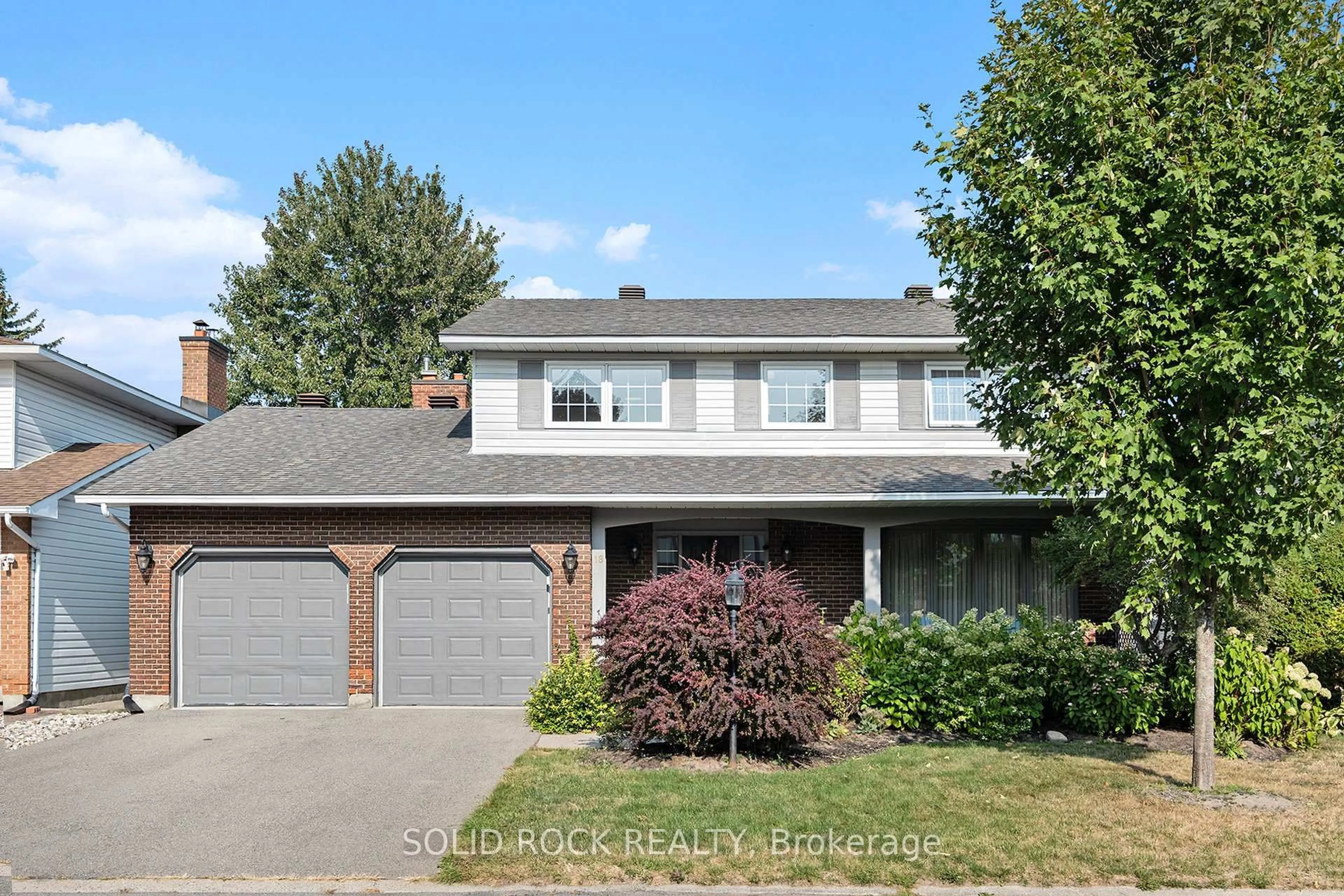 Home with vinyl exterior material, street for 18 Falk Ave, Barrhaven Ontario K2J 1L1