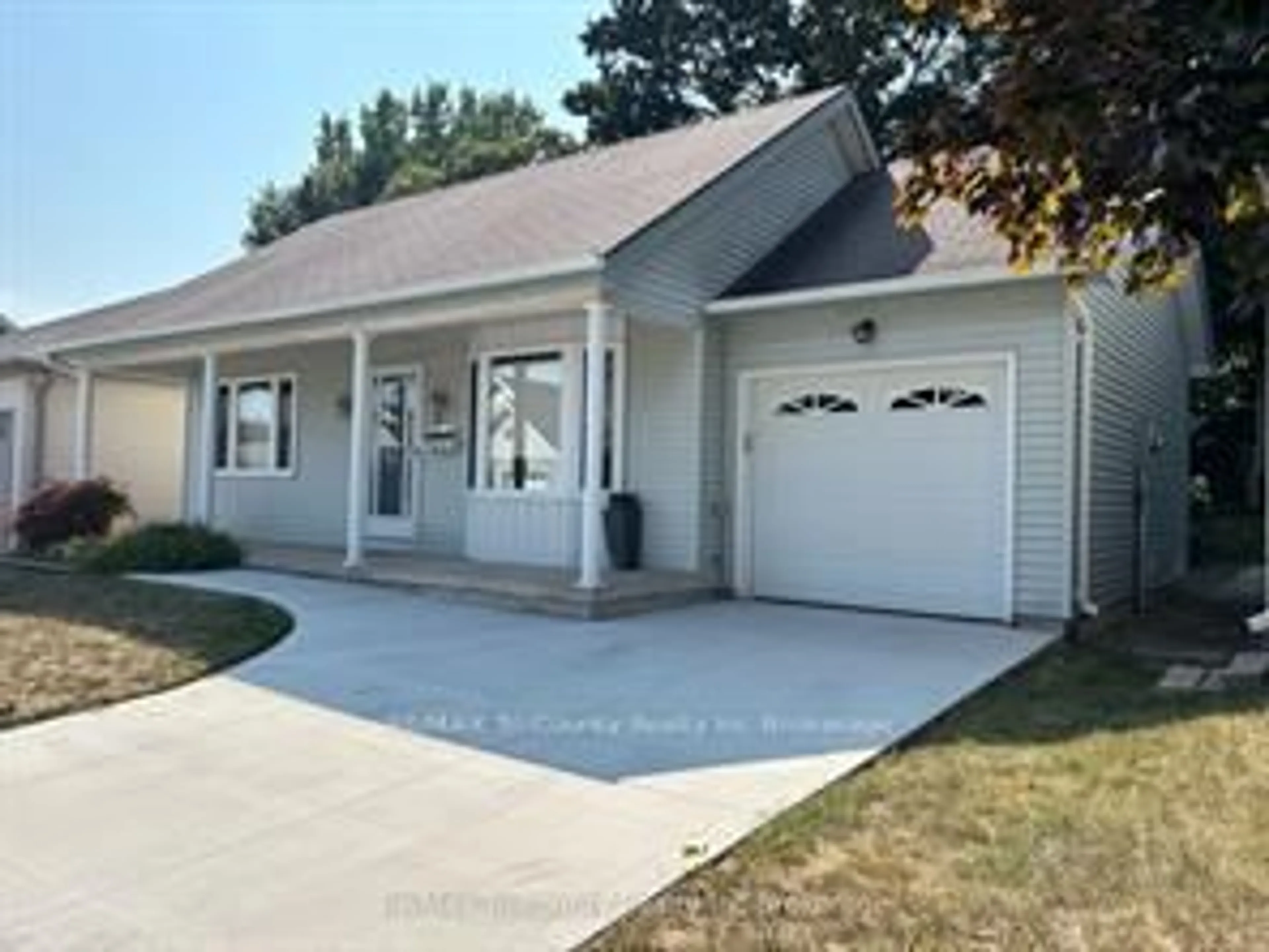 Home with vinyl exterior material, street for 18 Wilkins Cres, Tillsonburg Ontario N4G 5M6