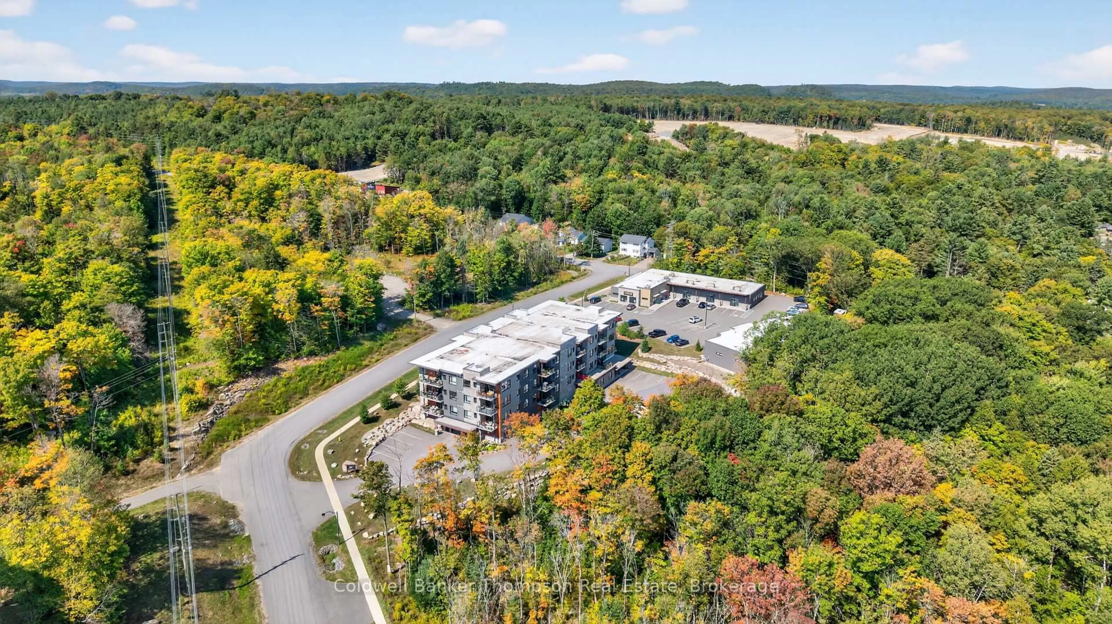 A pic from outside/outdoor area/front of a property/back of a property/a pic from drone, building for 23 Campus Tr ##102, Huntsville Ontario P1H 0G1