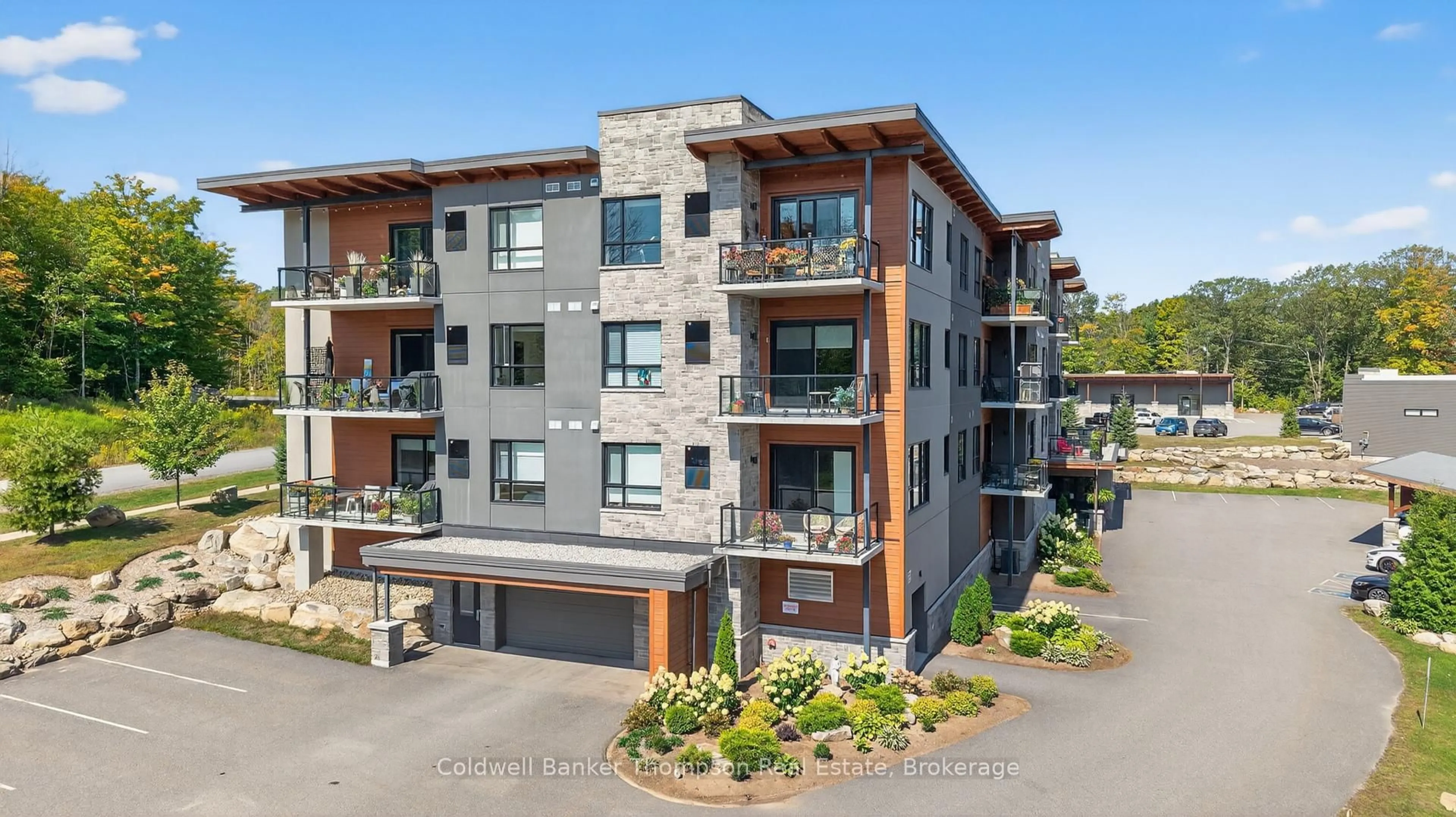 A pic from outside/outdoor area/front of a property/back of a property/a pic from drone, building for 23 Campus Tr ##102, Huntsville Ontario P1H 0G1