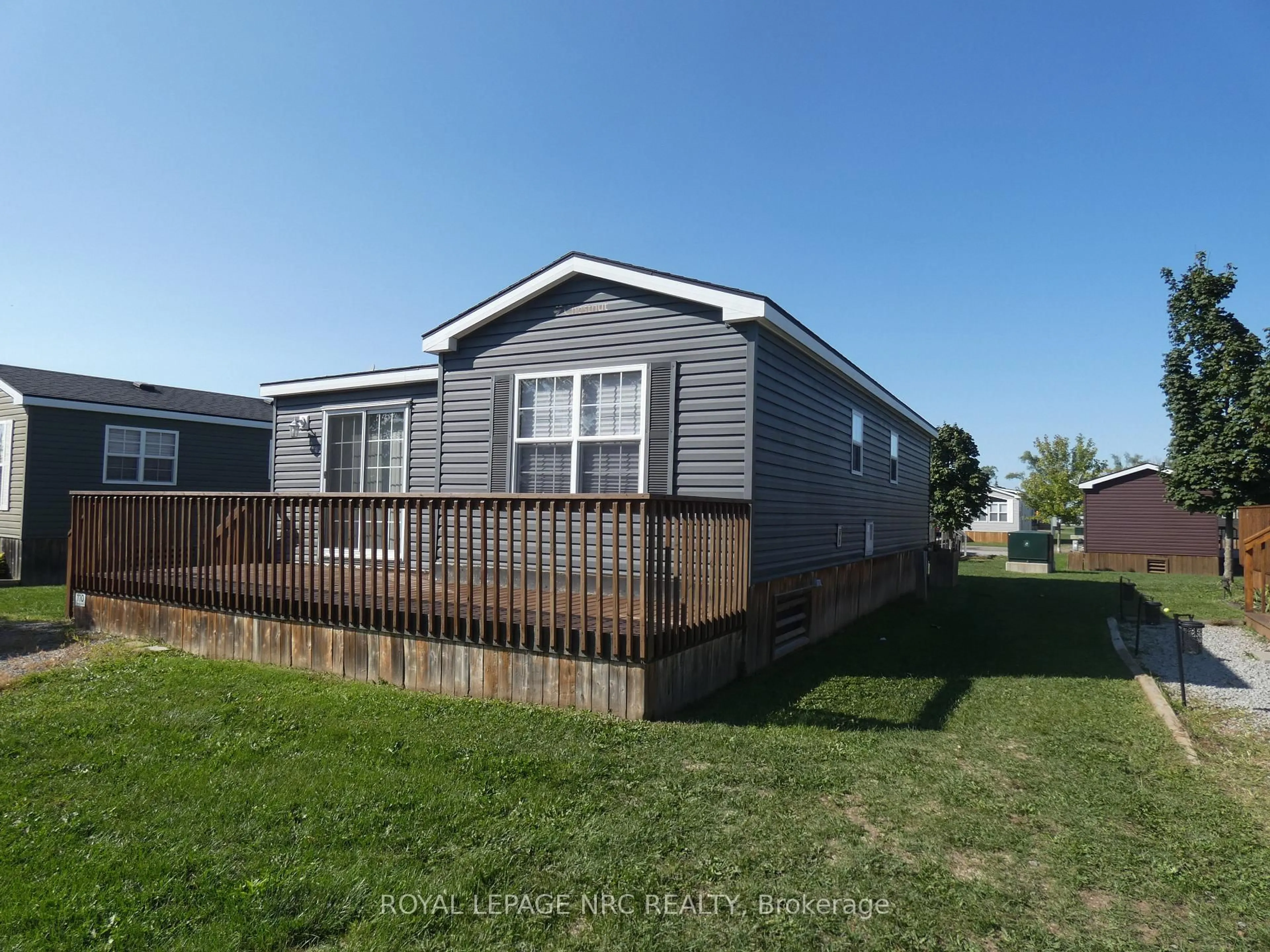 Home with vinyl exterior material, street for 1501 Line 8 Rd #110, Niagara-on-the-Lake Ontario L0S 1J0