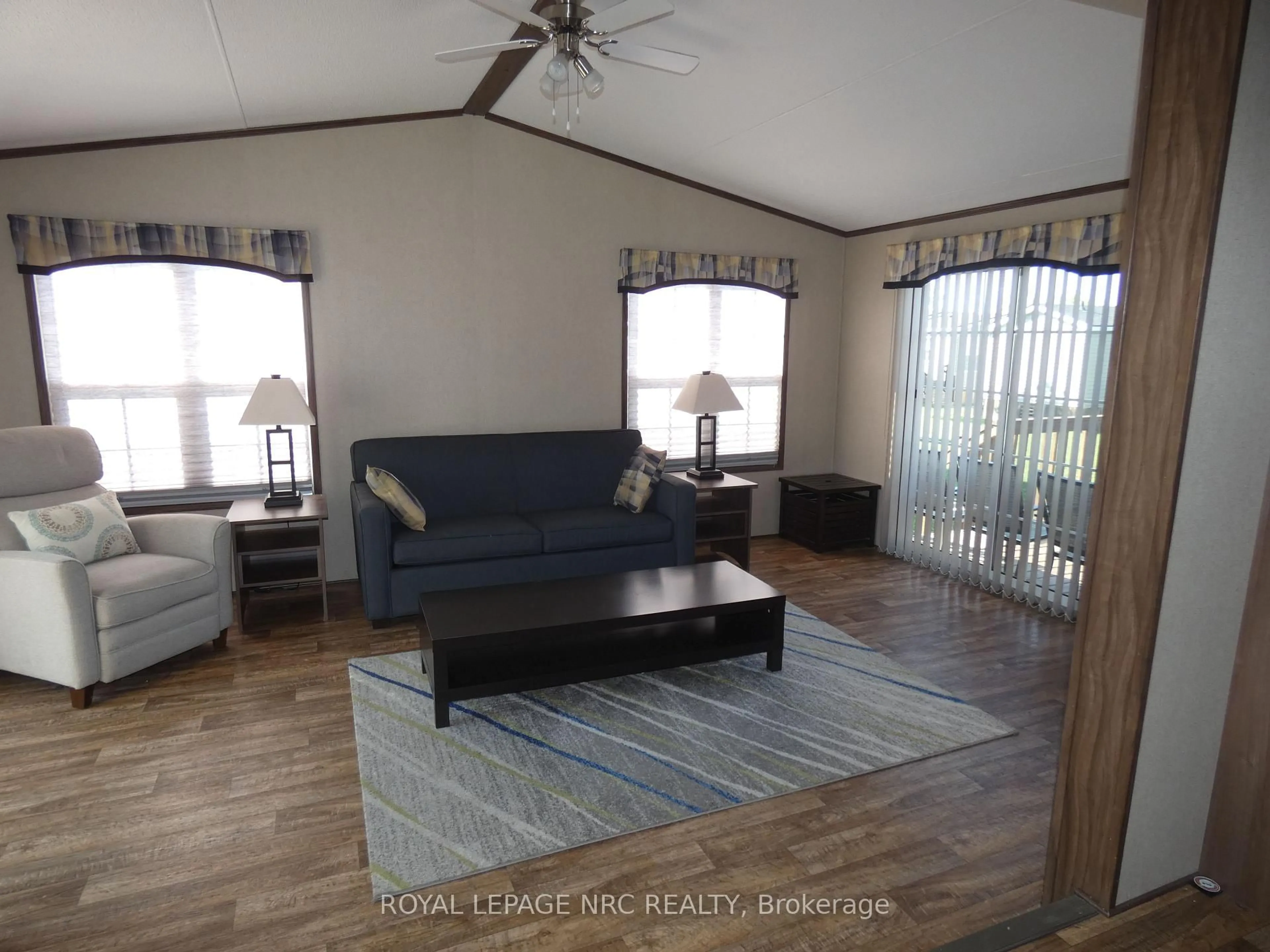 Living room with furniture, wood/laminate floor for 1501 Line 8 Rd #110, Niagara-on-the-Lake Ontario L0S 1J0