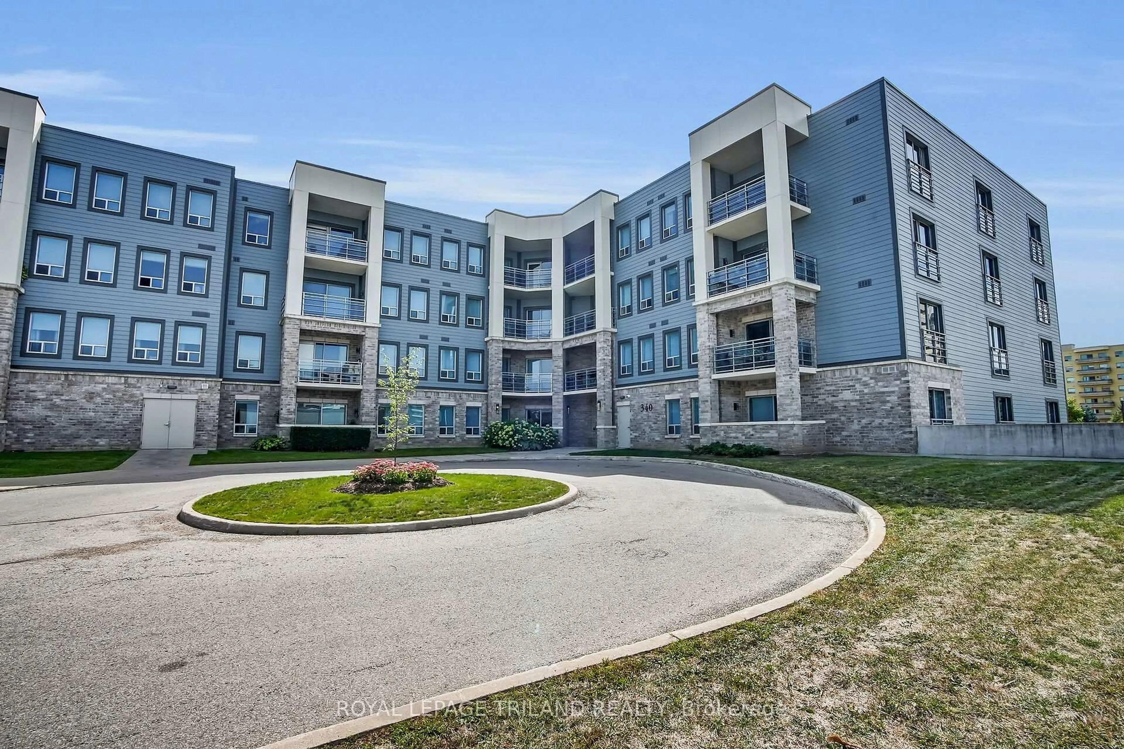 A pic from outside/outdoor area/front of a property/back of a property/a pic from drone, building for 340 Sugarcreek Tr #401, London North Ontario N6H 0G4