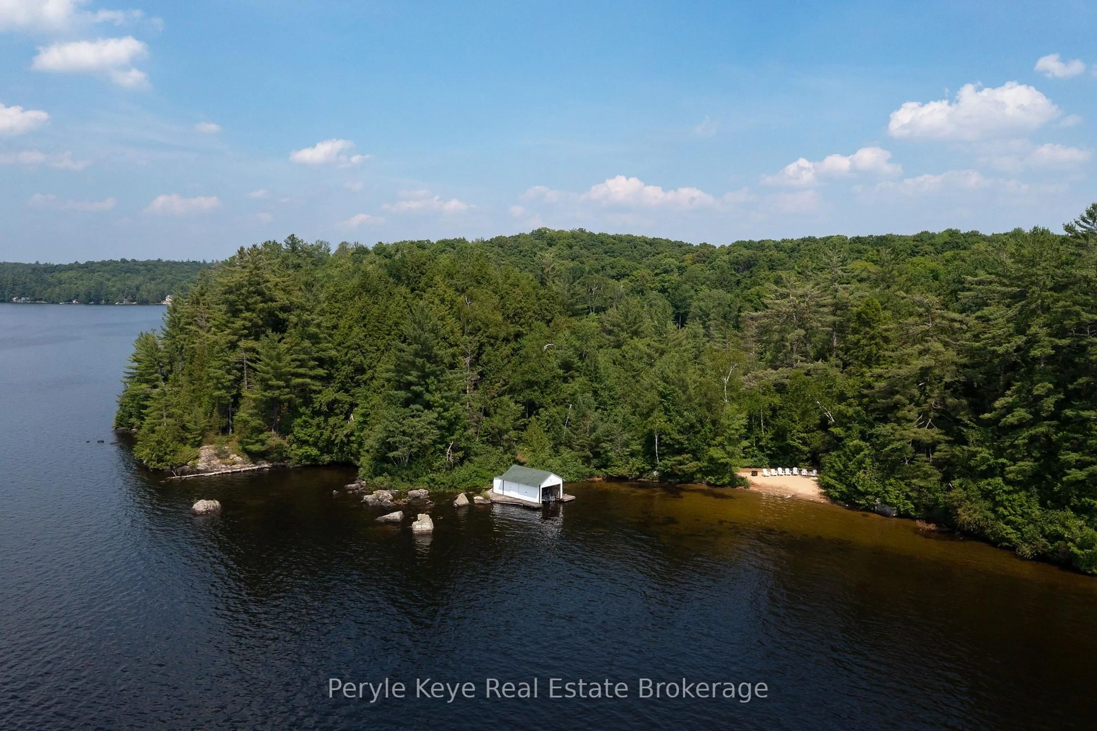 A pic from outside/outdoor area/front of a property/back of a property/a pic from drone, water/lake/river/ocean view for 1187 Rignalls Rd, Bracebridge Ontario P1L 1X1