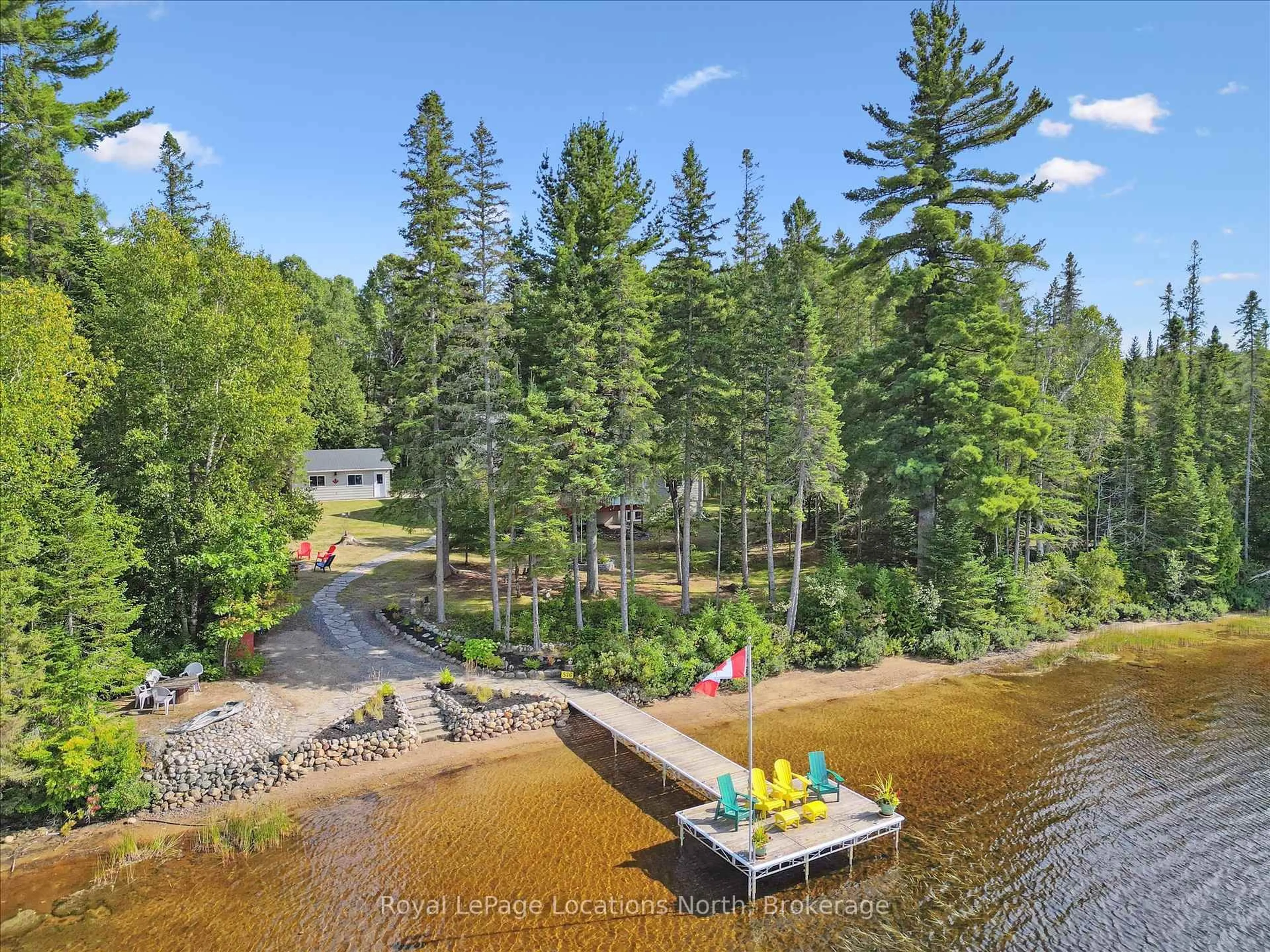 A pic from outside/outdoor area/front of a property/back of a property/a pic from drone, water/lake/river/ocean view for 576 Clam Lake Rd, Kearney Ontario P0A 1M0