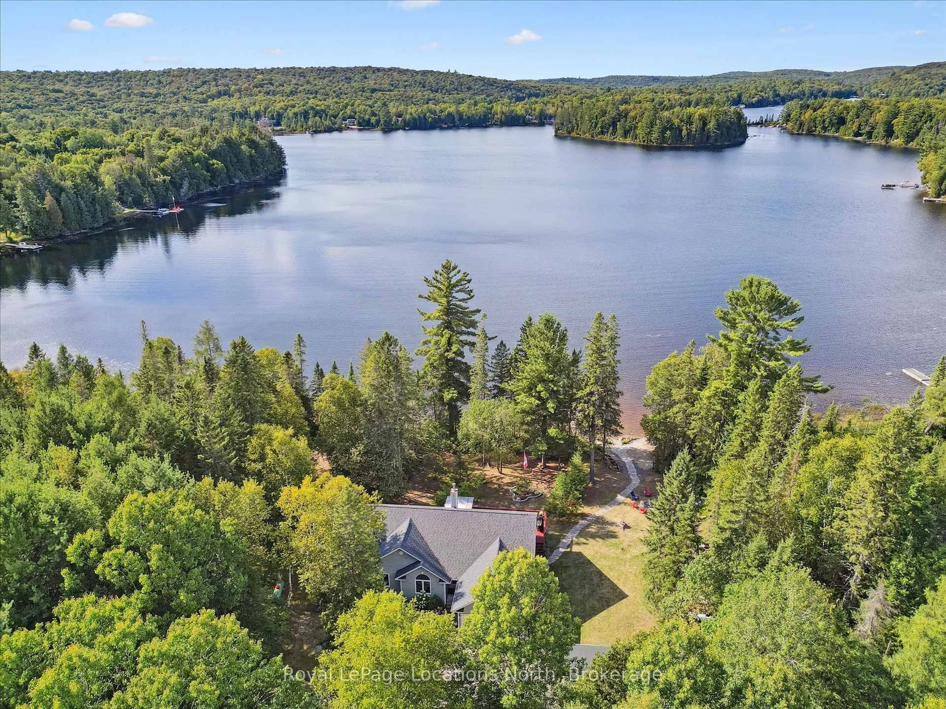 A pic from outside/outdoor area/front of a property/back of a property/a pic from drone, water/lake/river/ocean view for 576 Clam Lake Rd, Kearney Ontario P0A 1M0