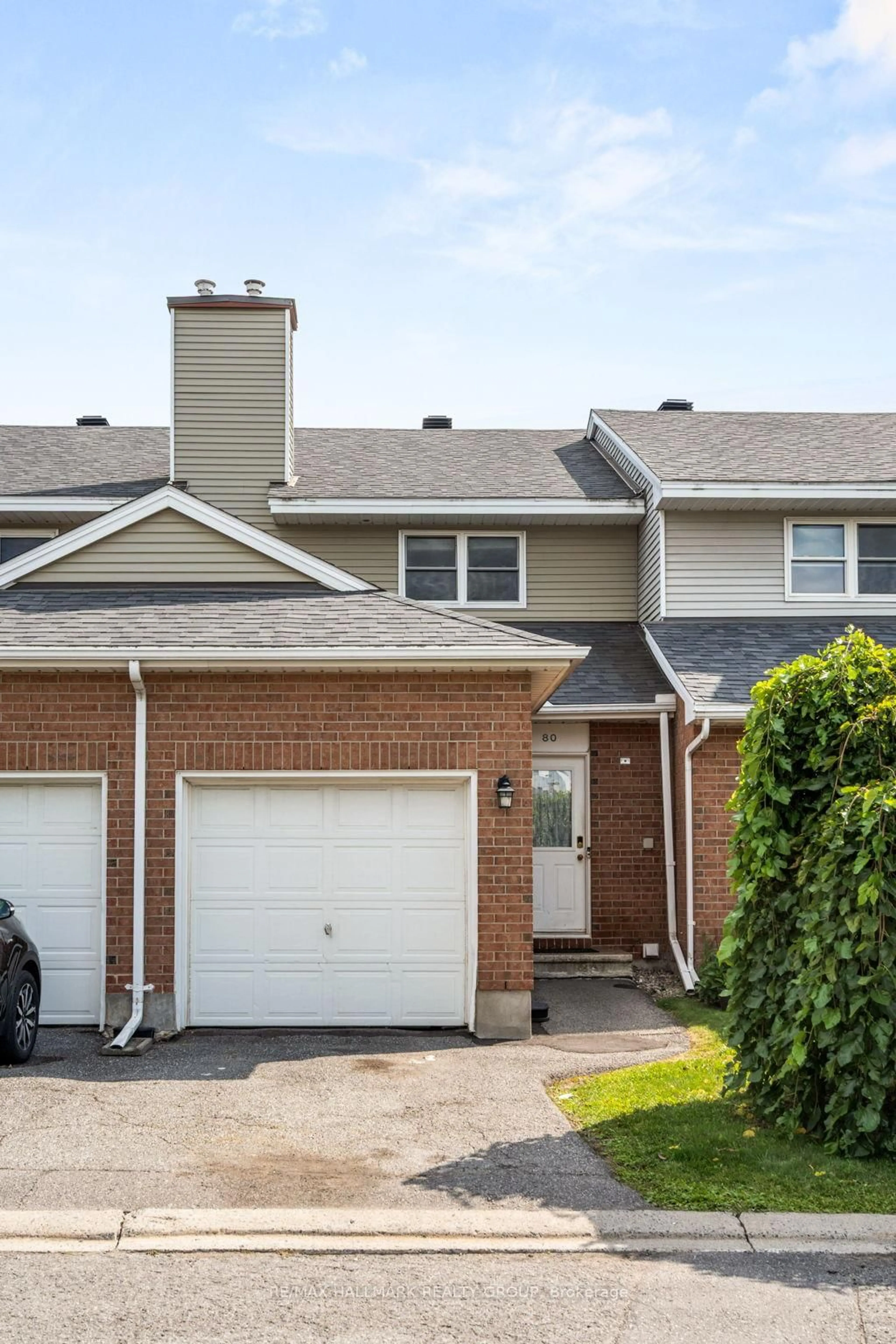 Home with vinyl exterior material, street for 80 Bentbrook Cres #43, Ottawa Ontario K2J 3Y1