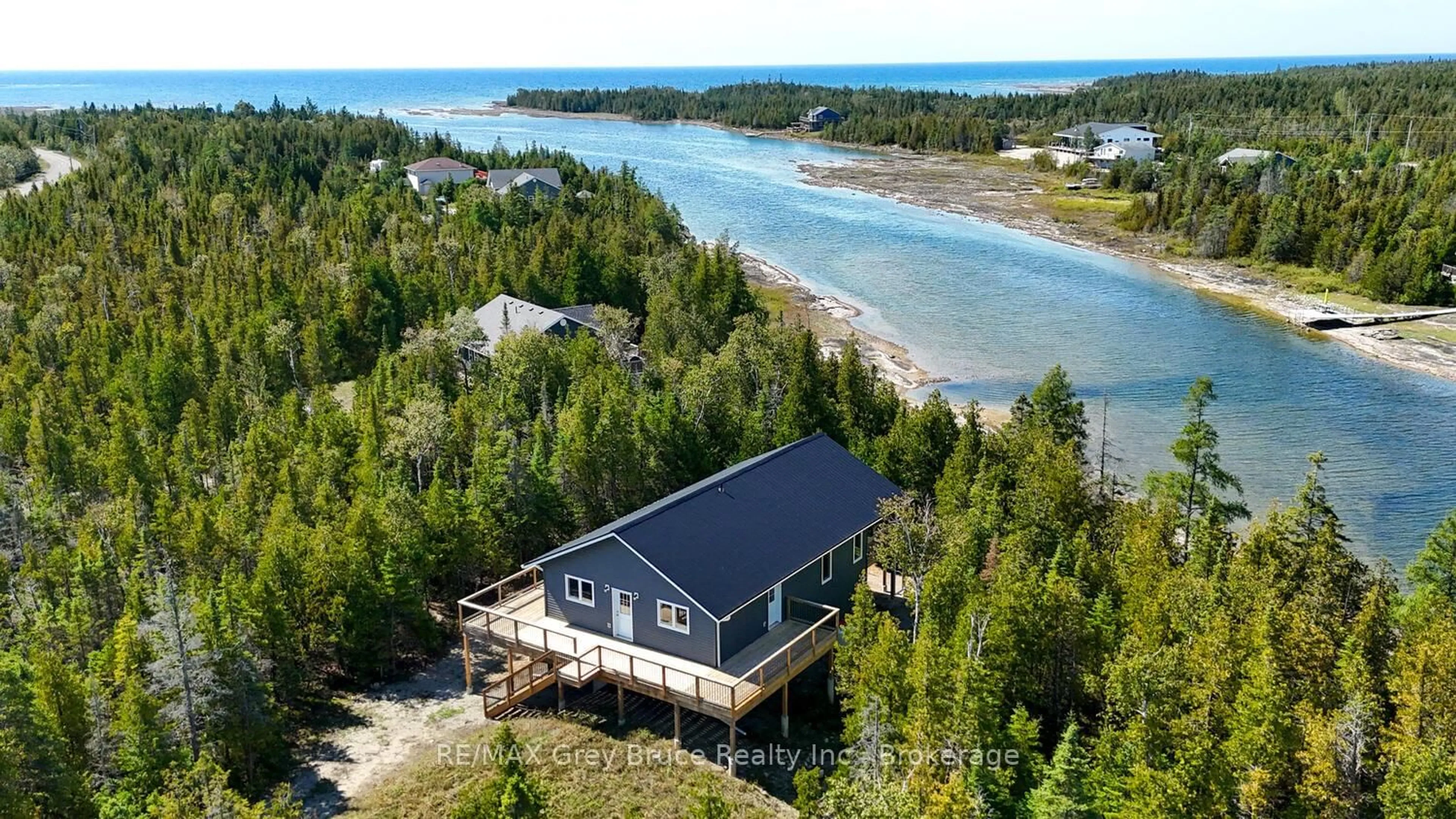 A pic from outside/outdoor area/front of a property/back of a property/a pic from drone, water/lake/river/ocean view for 38 Bay Shore Ave, Northern Bruce Peninsula Ontario N0H 2R0