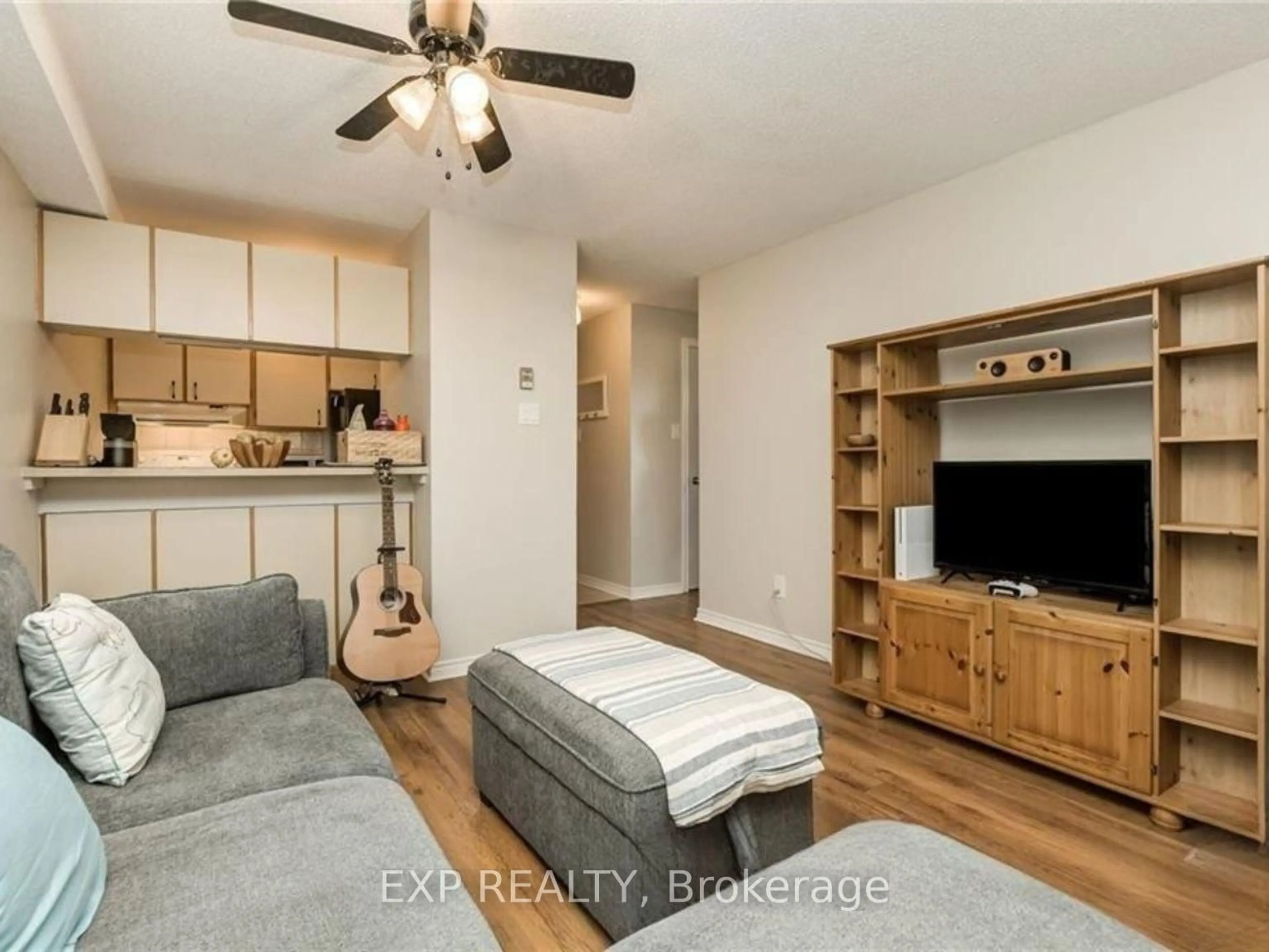 Living room with furniture, wood/laminate floor for 6376 Bilberry Dr #306, Ottawa Ontario K1C 4P6