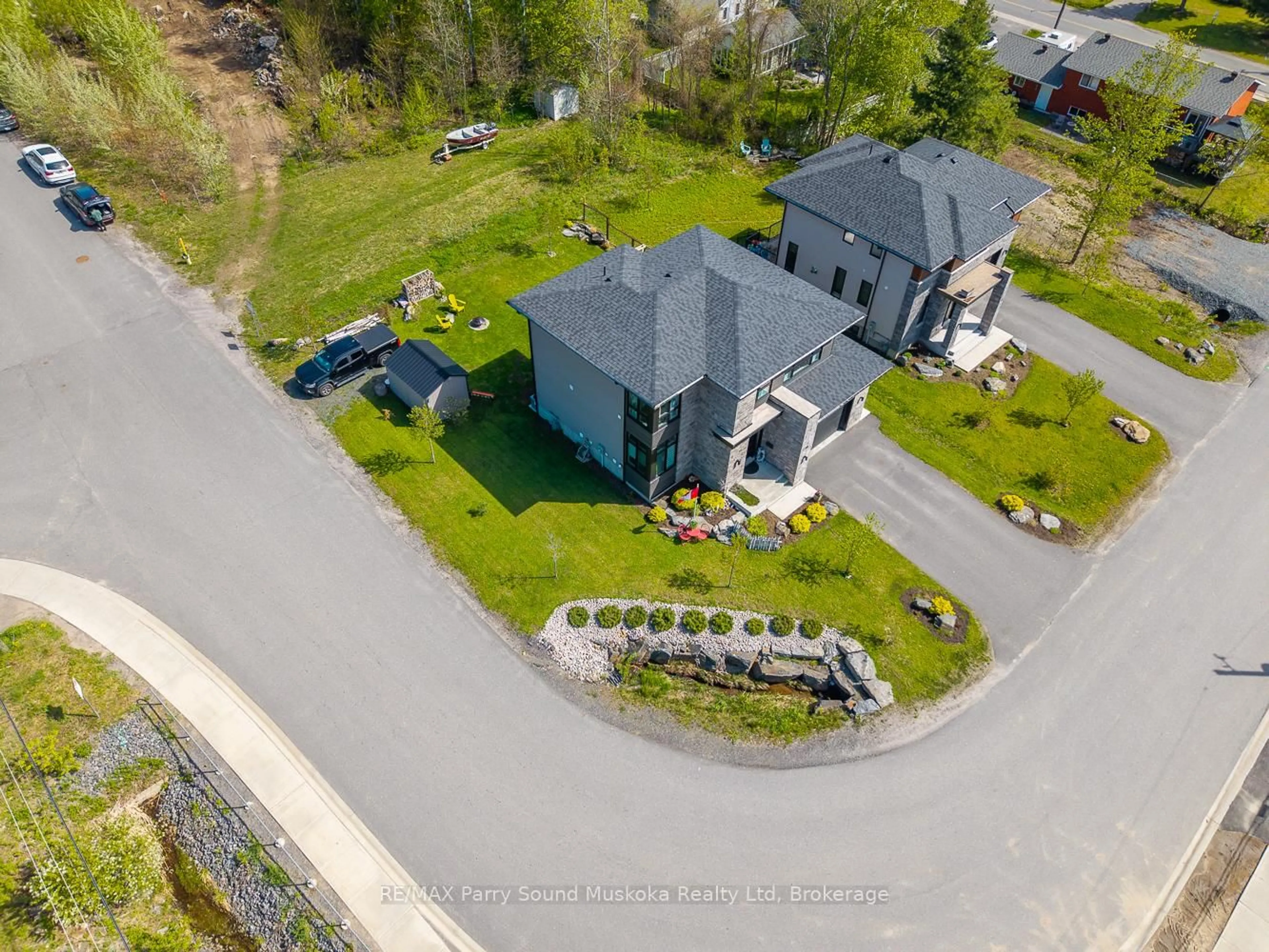 A pic from outside/outdoor area/front of a property/back of a property/a pic from drone, street for 44 Dennis Dr, Parry Sound Ontario P2A 0E6